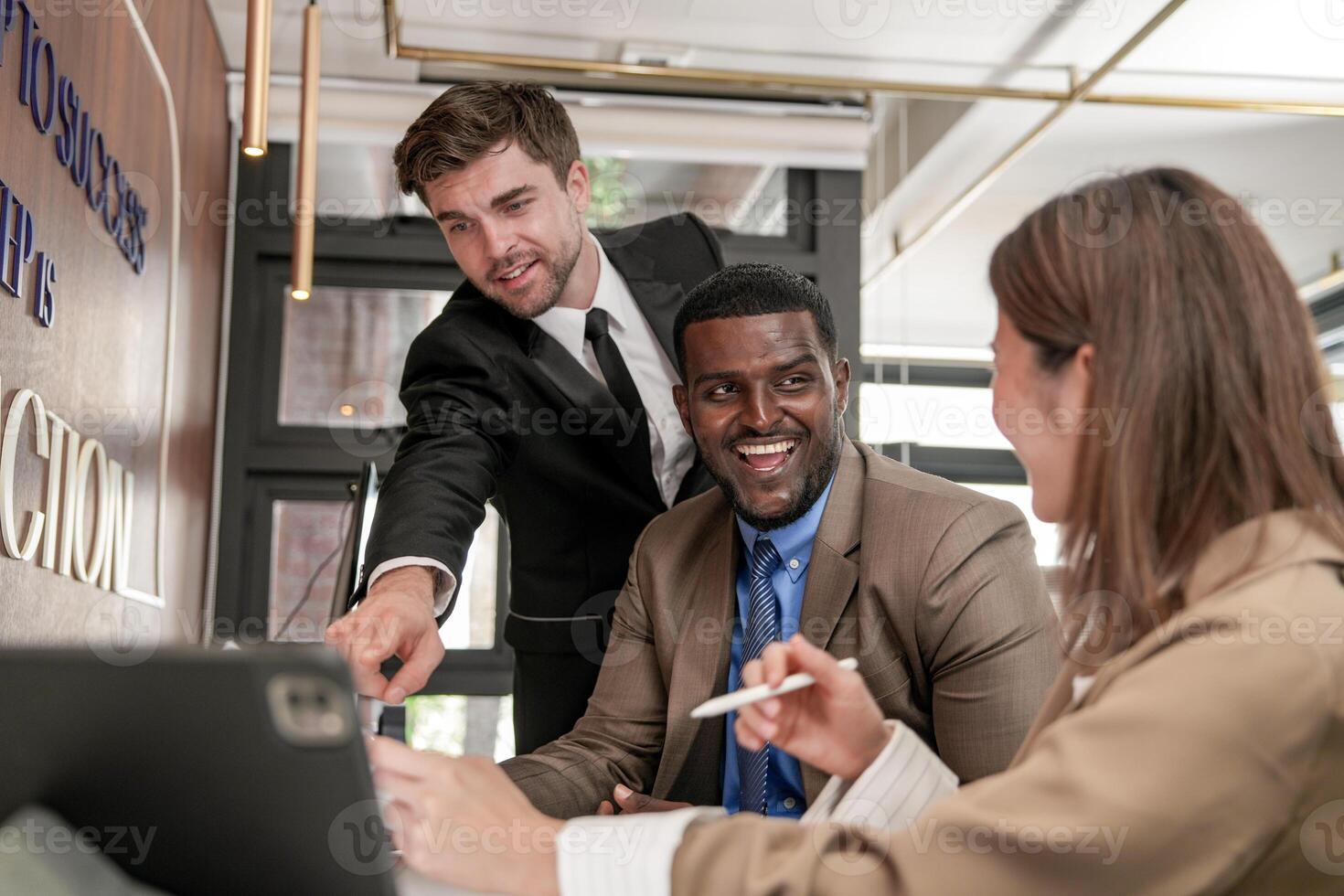 Diverse employees gathered in office having fun during brainstorming while discussing new ideas project. Multiracial coworkers meeting at coworking space area. team of young people in office. photo