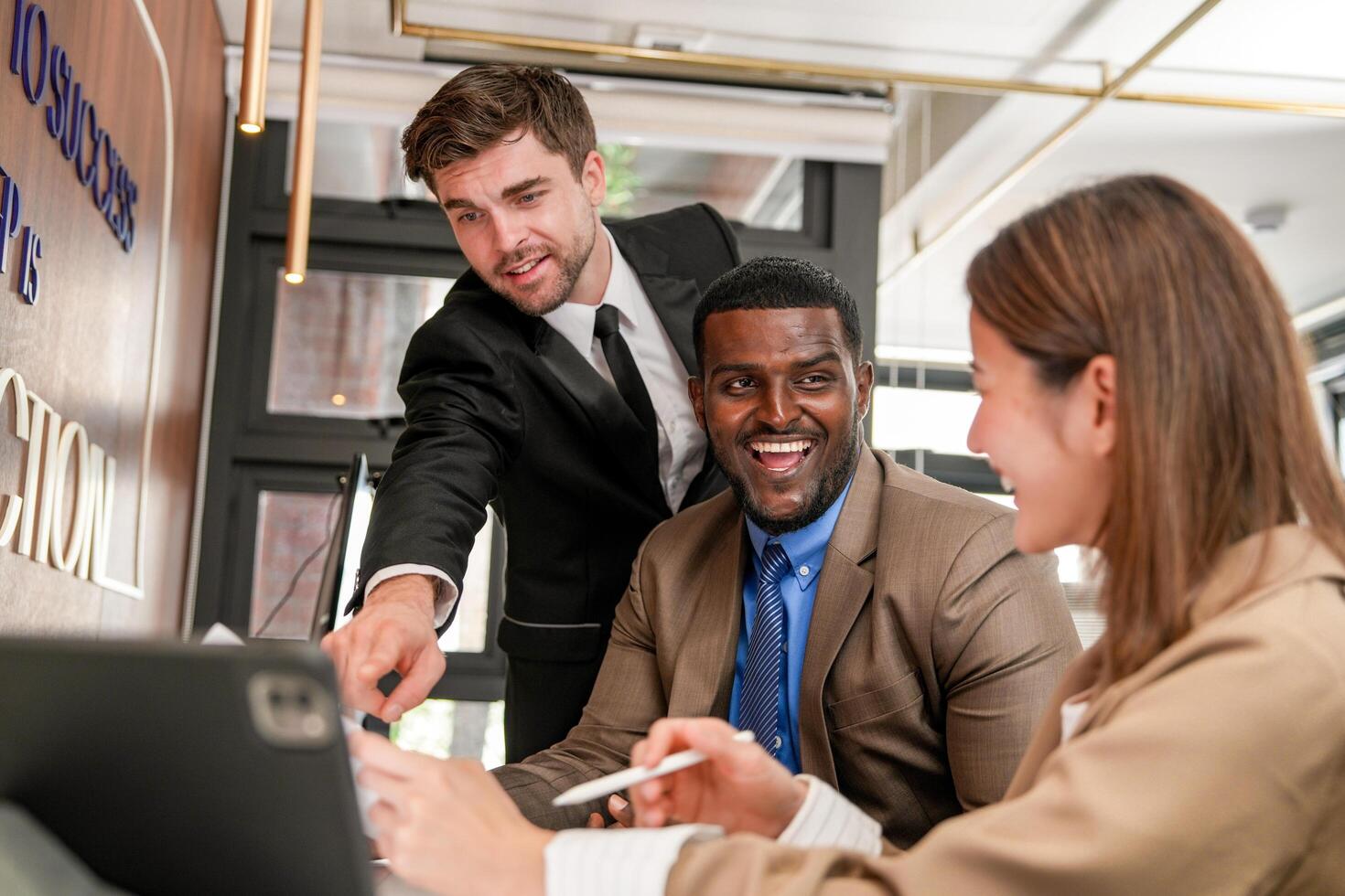 Diverse employees gathered in office having fun during brainstorming while discussing new ideas project. Multiracial coworkers meeting at coworking space area. team of young people in office. photo