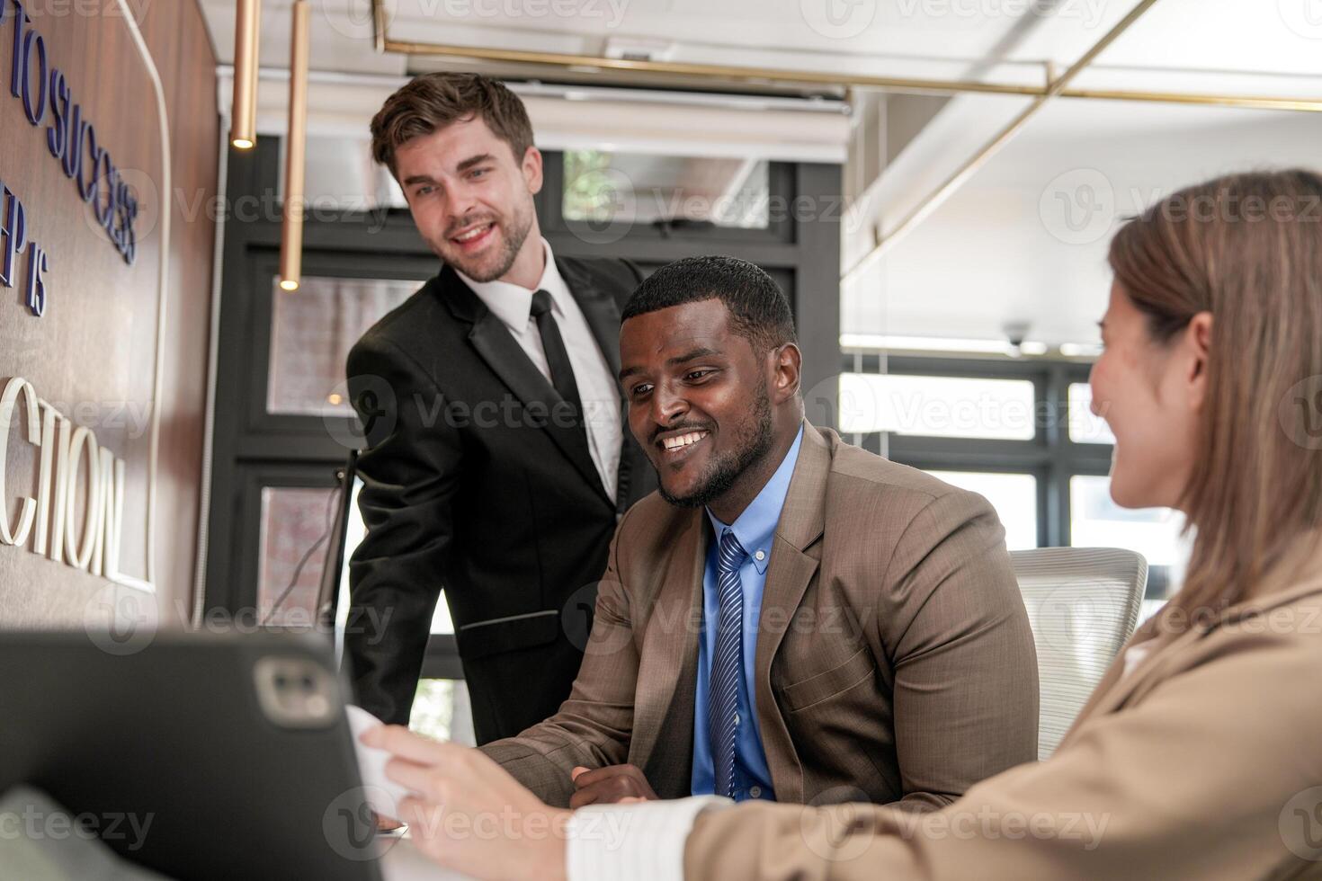 Diverse employees gathered in office having fun during brainstorming while discussing new ideas project. Multiracial coworkers meeting at coworking space area. team of young people in office. photo