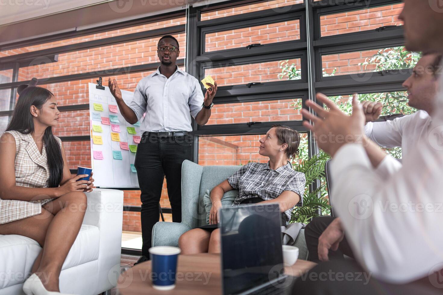 people talk and present the project. Relaxed informal business company meeting. Team leader brainstorming new approaches and ideas with colleagues. Startup business and entrepreneurship concept. photo