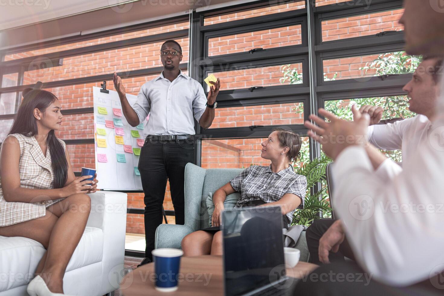 people talk and present the project. Relaxed informal business company meeting. Team leader brainstorming new approaches and ideas with colleagues. Startup business and entrepreneurship concept. photo
