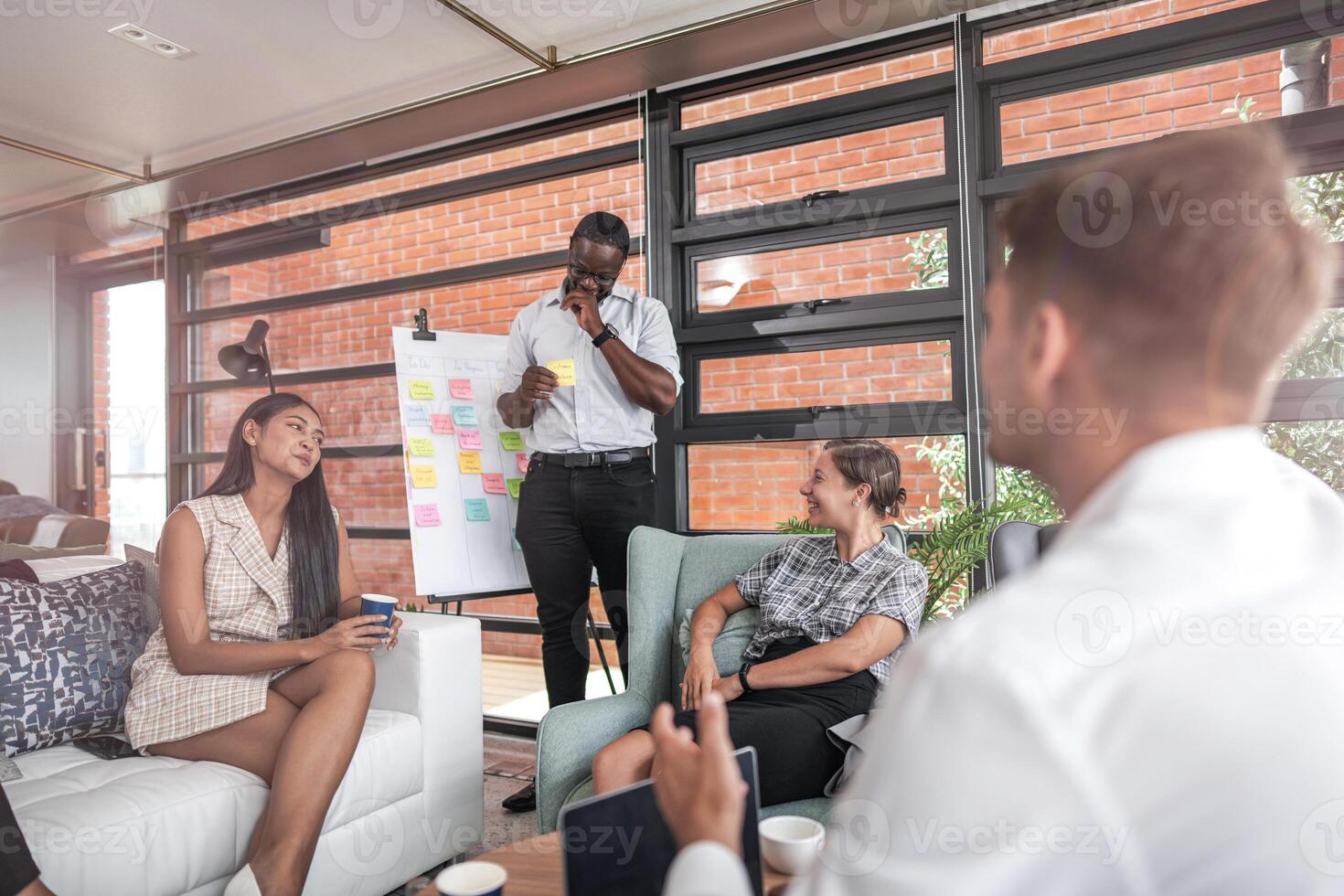 people talk and present the project. Relaxed informal business company meeting. Team leader brainstorming new approaches and ideas with colleagues. Startup business and entrepreneurship concept. photo