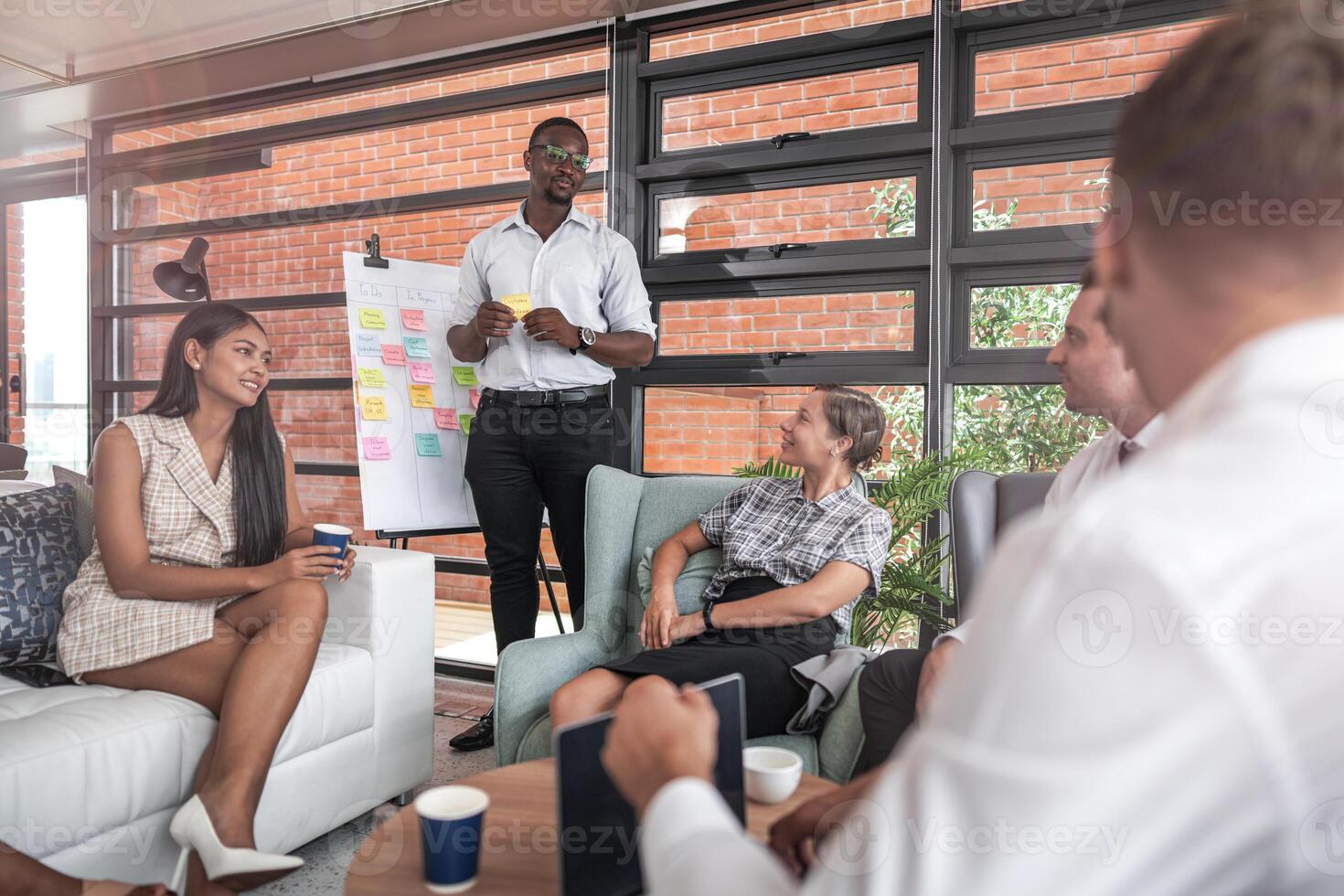 people talk and present the project. Relaxed informal business company meeting. Team leader brainstorming new approaches and ideas with colleagues. Startup business and entrepreneurship concept. photo
