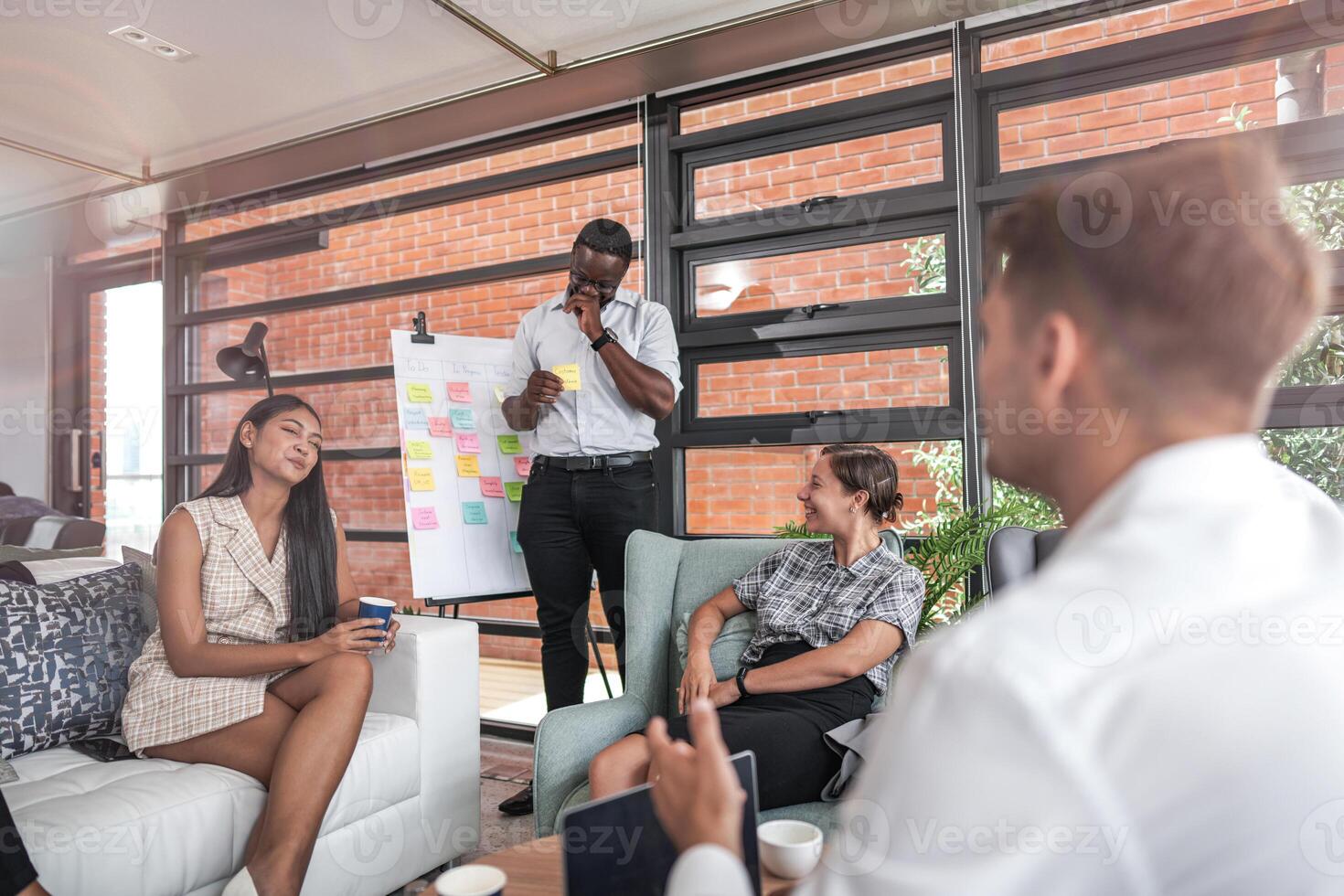 people talk and present the project. Relaxed informal business company meeting. Team leader brainstorming new approaches and ideas with colleagues. Startup business and entrepreneurship concept. photo