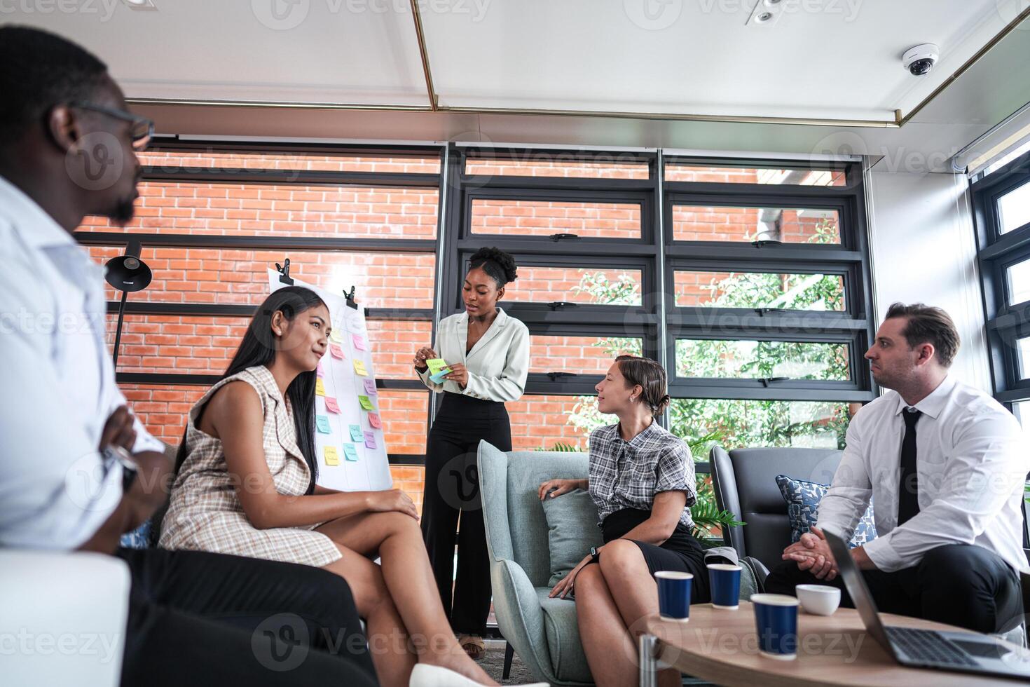 people talk and present the project. Relaxed informal business company meeting. Team leader brainstorming new approaches and ideas with colleagues. Startup business and entrepreneurship concept. photo