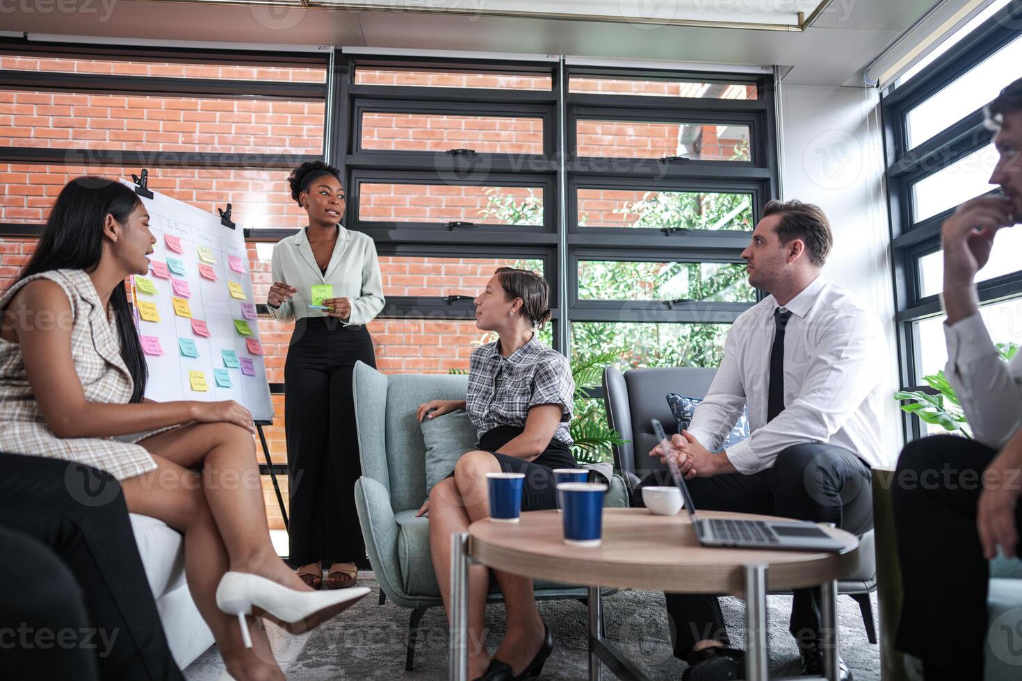 people talk and present the project. Relaxed informal business company meeting. Team leader brainstorming new approaches and ideas with colleagues. Startup business and entrepreneurship concept. photo