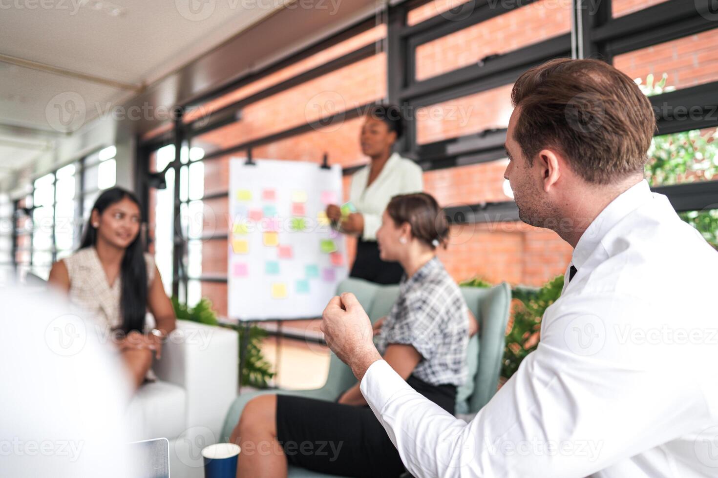 people talk and present the project. Relaxed informal business company meeting. Team leader brainstorming new approaches and ideas with colleagues. Startup business and entrepreneurship concept. photo