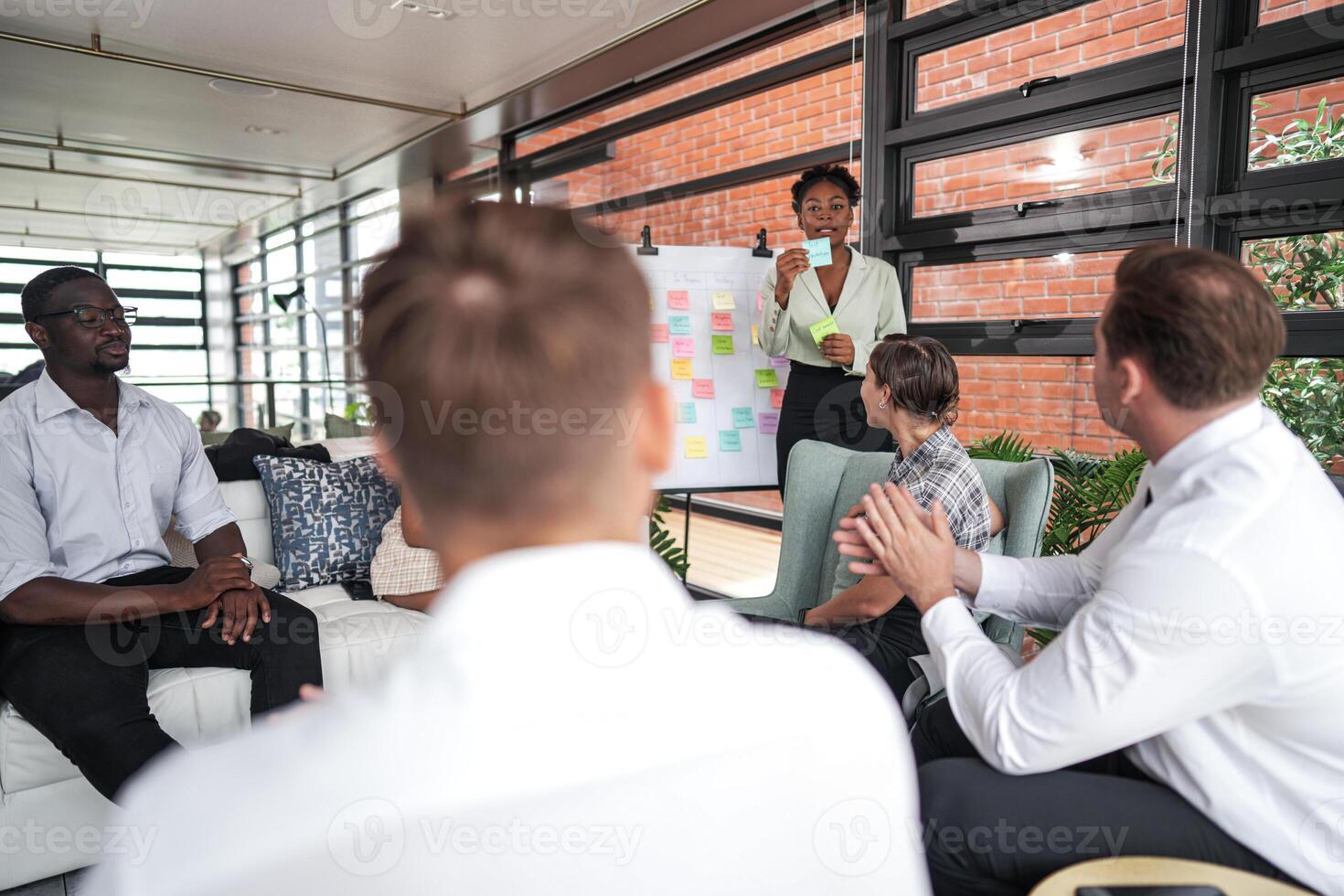 people talk and present the project. Relaxed informal business company meeting. Team leader brainstorming new approaches and ideas with colleagues. Startup business and entrepreneurship concept. photo