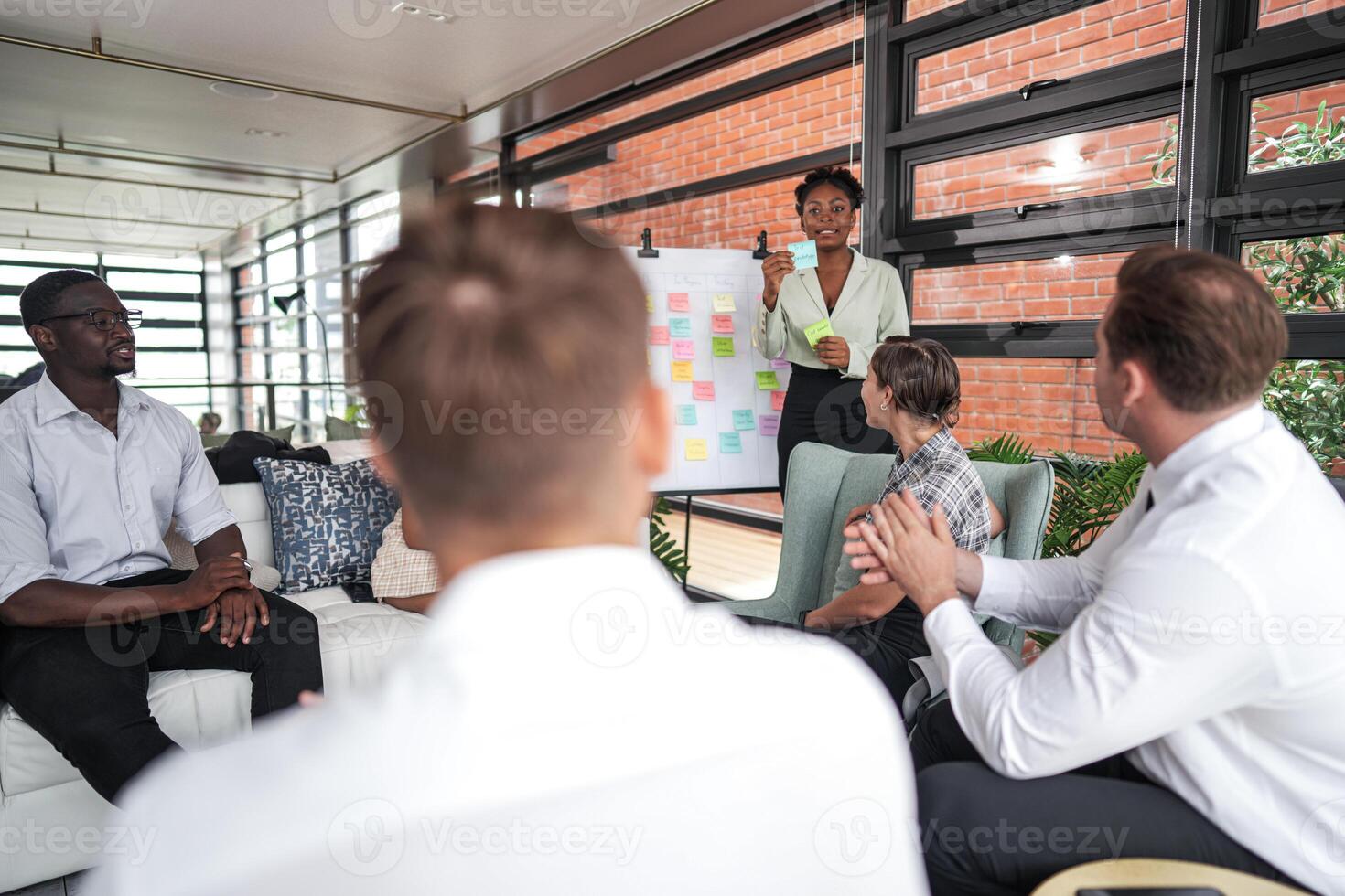 people talk and present the project. Relaxed informal business company meeting. Team leader brainstorming new approaches and ideas with colleagues. Startup business and entrepreneurship concept. photo