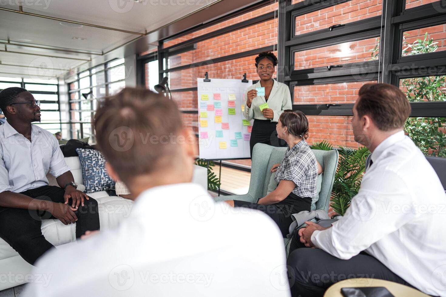 people talk and present the project. Relaxed informal business company meeting. Team leader brainstorming new approaches and ideas with colleagues. Startup business and entrepreneurship concept. photo