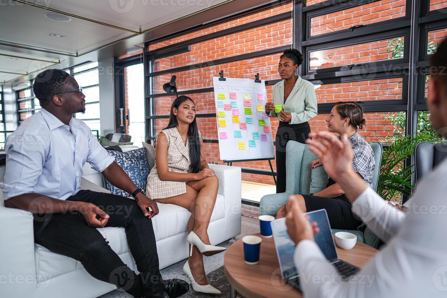 people talk and present the project. Relaxed informal business company meeting. Team leader brainstorming new approaches and ideas with colleagues. Startup business and entrepreneurship concept. photo