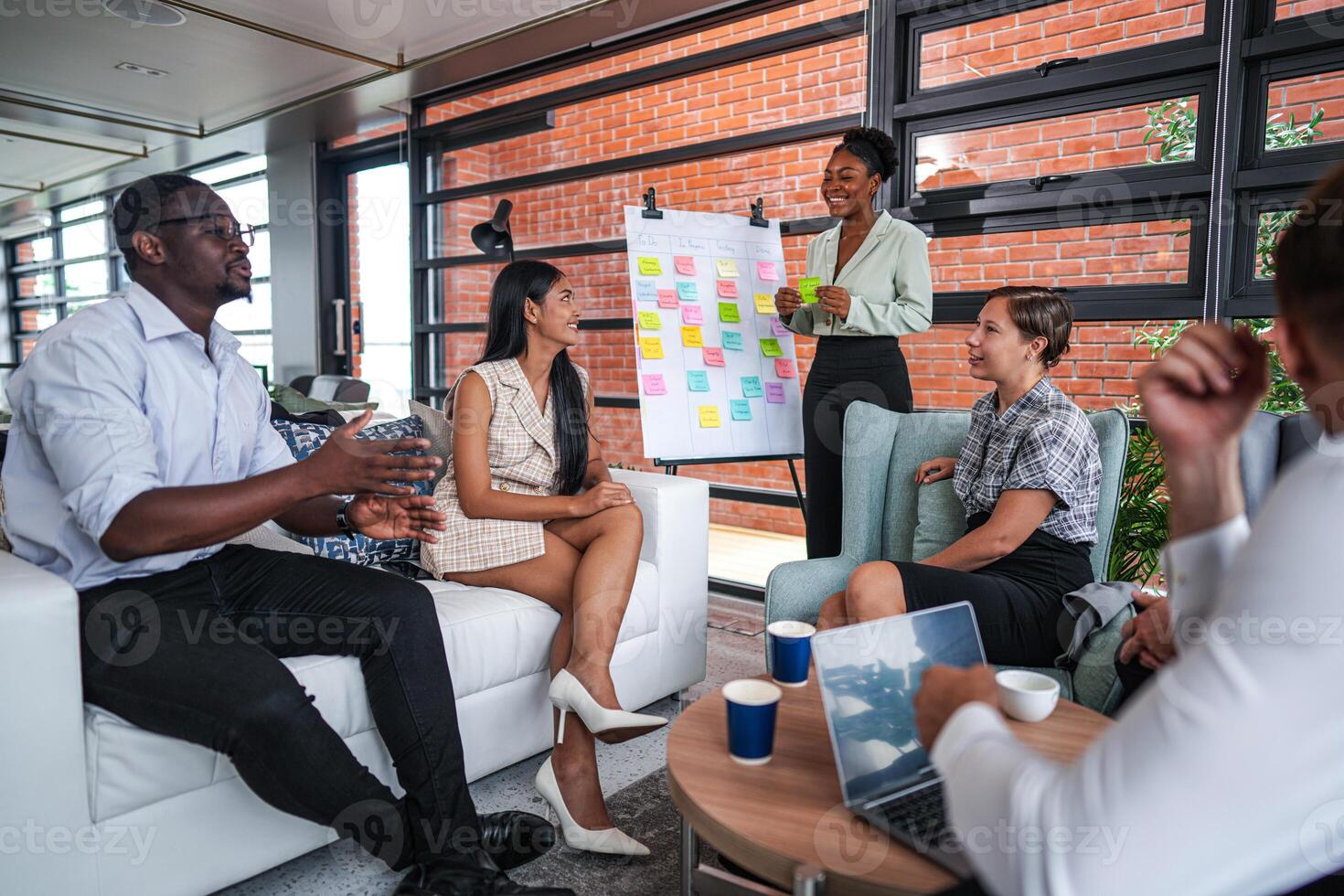 people talk and present the project. Relaxed informal business company meeting. Team leader brainstorming new approaches and ideas with colleagues. Startup business and entrepreneurship concept. photo