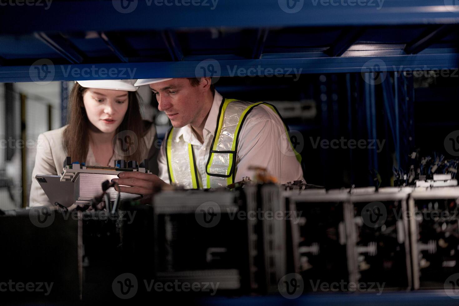 checking and inspecting metal machine part items for shipping. male and woman worker checking the store factory. industry factory warehouse. The warehouse of spare part for machinery and vehicles. photo