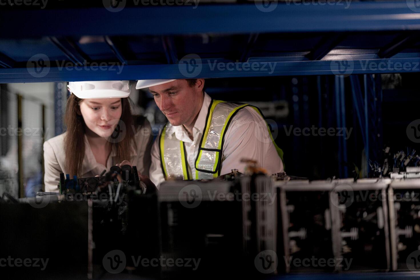 checking and inspecting metal machine part items for shipping. male and woman worker checking the store factory. industry factory warehouse. The warehouse of spare part for machinery and vehicles. photo