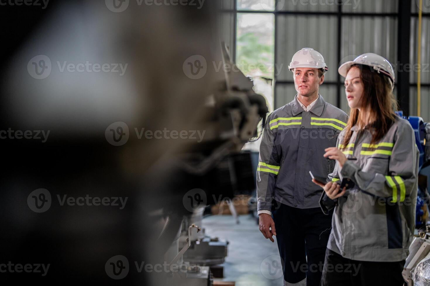 engineers check control heavy machine robot arm. Diverse Team of Industrial Robotics Engineers Gathered Around Machine. Professional Machinery Operators repair electric robot on bright digital panel. photo