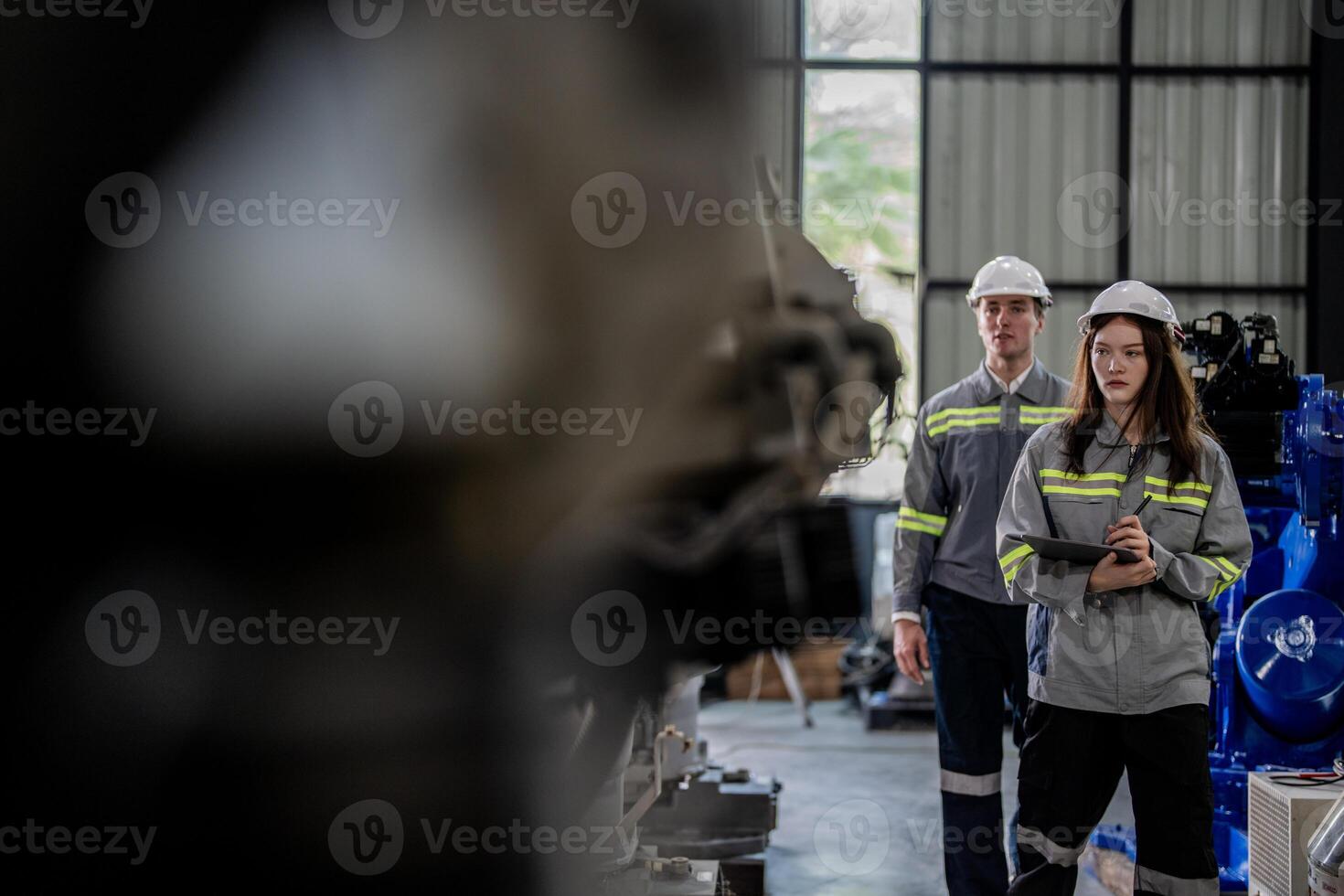 engineers check control heavy machine robot arm. Diverse Team of Industrial Robotics Engineers Gathered Around Machine. Professional Machinery Operators repair electric robot on bright digital panel. photo