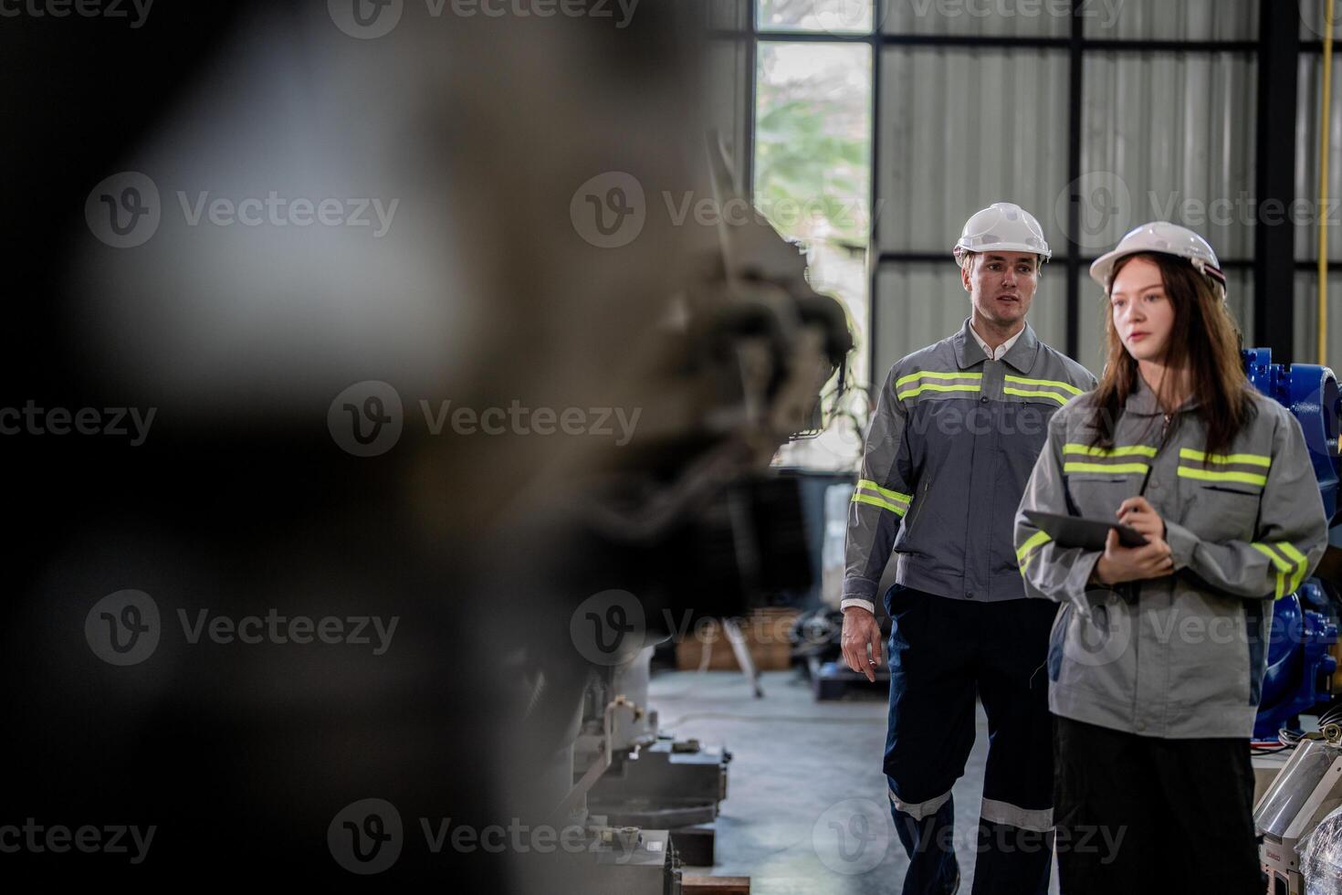 engineers check control heavy machine robot arm. Diverse Team of Industrial Robotics Engineers Gathered Around Machine. Professional Machinery Operators repair electric robot on bright digital panel. photo