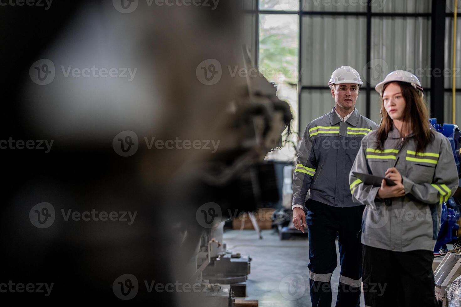engineers check control heavy machine robot arm. Diverse Team of Industrial Robotics Engineers Gathered Around Machine. Professional Machinery Operators repair electric robot on bright digital panel. photo