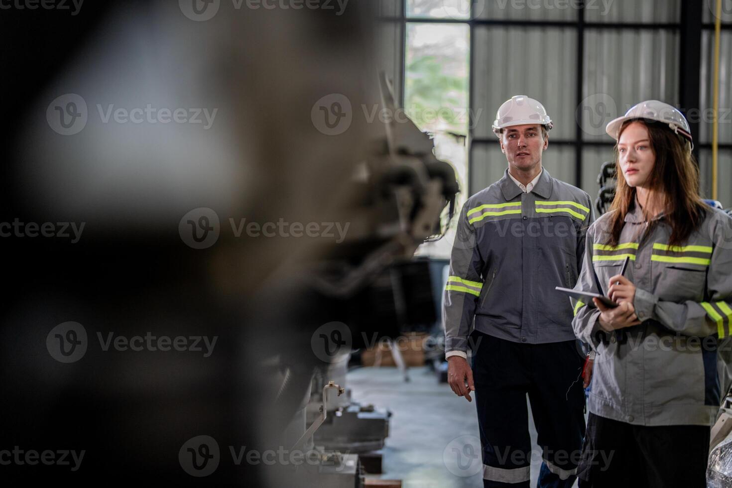 engineers check control heavy machine robot arm. Diverse Team of Industrial Robotics Engineers Gathered Around Machine. Professional Machinery Operators repair electric robot on bright digital panel. photo