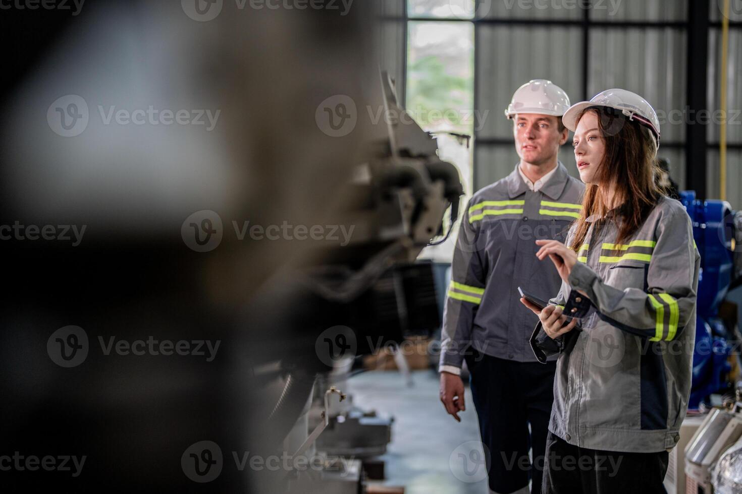 engineers check control heavy machine robot arm. Diverse Team of Industrial Robotics Engineers Gathered Around Machine. Professional Machinery Operators repair electric robot on bright digital panel. photo