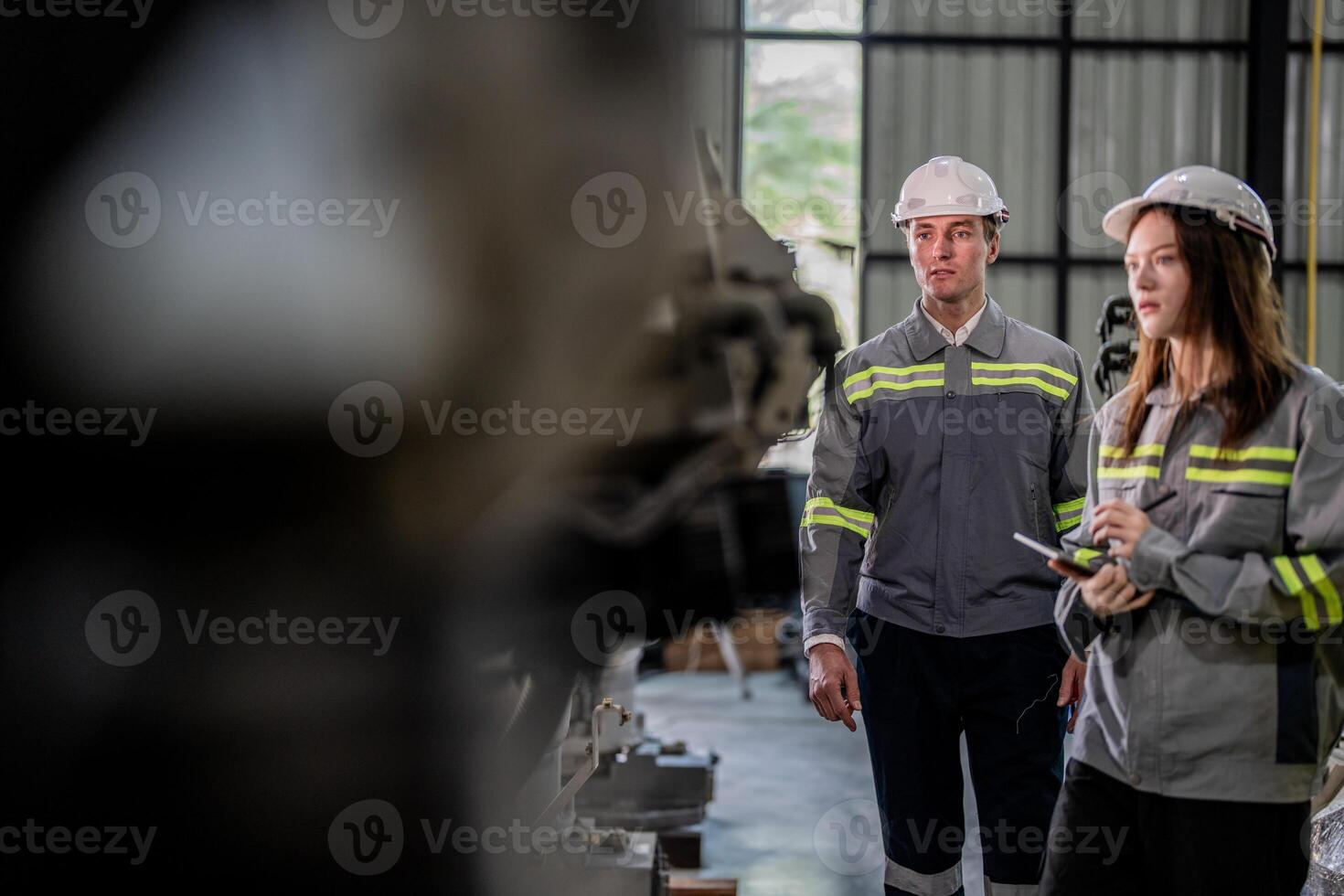 engineers check control heavy machine robot arm. Diverse Team of Industrial Robotics Engineers Gathered Around Machine. Professional Machinery Operators repair electric robot on bright digital panel. photo