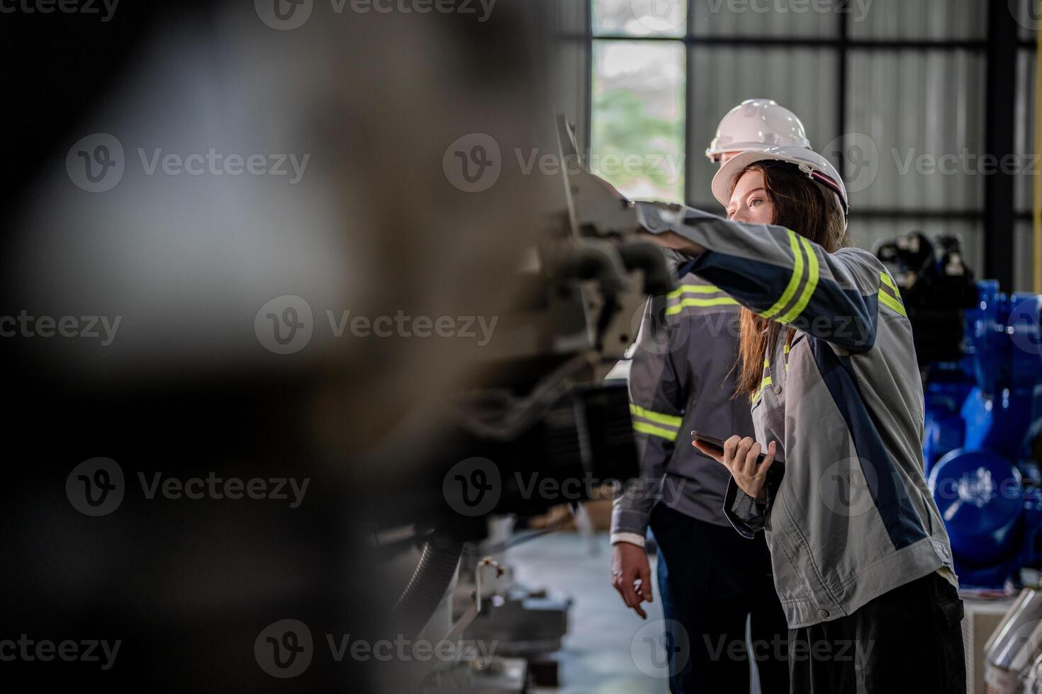 engineers check control heavy machine robot arm. Diverse Team of Industrial Robotics Engineers Gathered Around Machine. Professional Machinery Operators repair electric robot on bright digital panel. photo