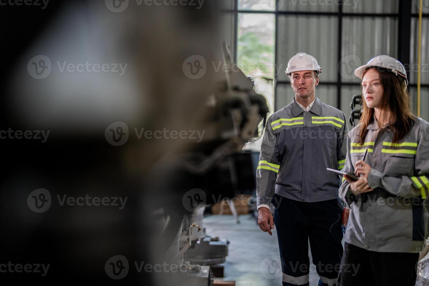 engineers check control heavy machine robot arm. Diverse Team of Industrial Robotics Engineers Gathered Around Machine. Professional Machinery Operators repair electric robot on bright digital panel. photo
