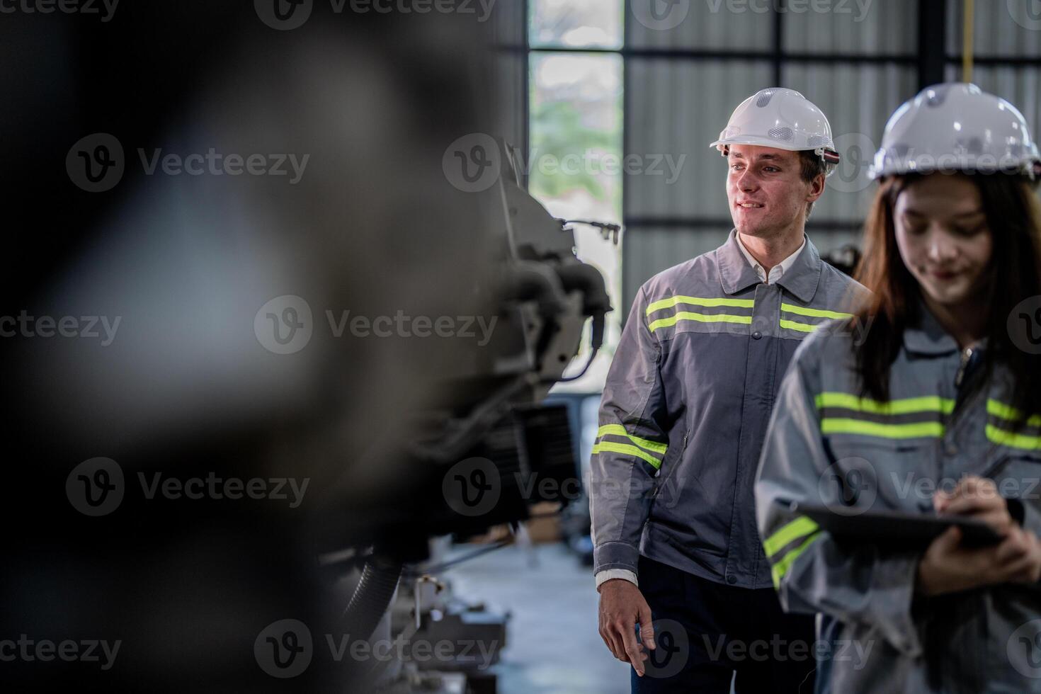 engineers check control heavy machine robot arm. Diverse Team of Industrial Robotics Engineers Gathered Around Machine. Professional Machinery Operators repair electric robot on bright digital panel. photo