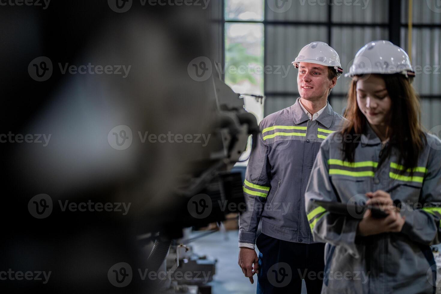 engineers check control heavy machine robot arm. Diverse Team of Industrial Robotics Engineers Gathered Around Machine. Professional Machinery Operators repair electric robot on bright digital panel. photo