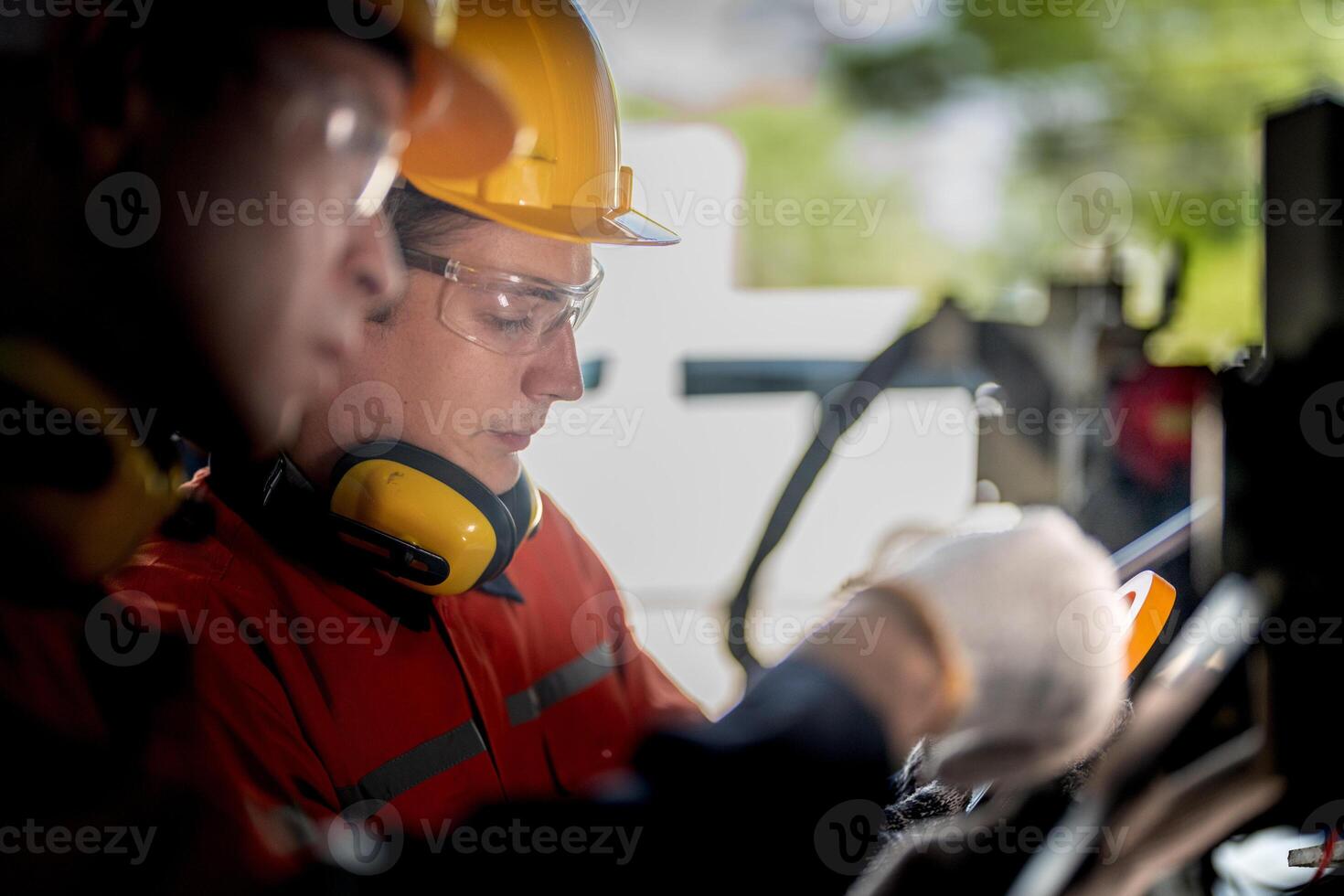 male engineer workers maintenance automatic robotic arm machine in a factory. worker checking and repairing automatic robot hand machine. technician worker check for repair factory machine. photo