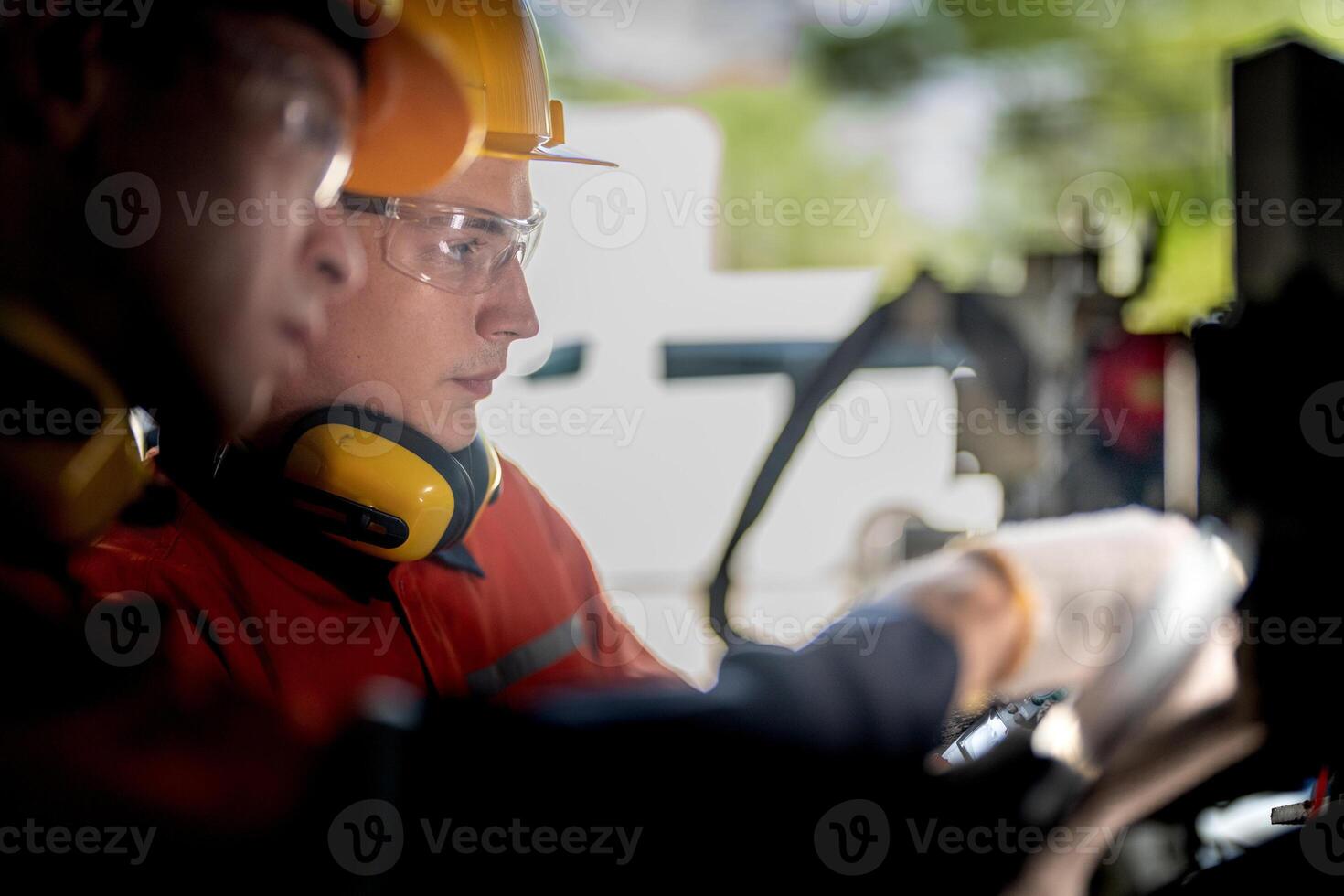 male engineer workers maintenance automatic robotic arm machine in a factory. worker checking and repairing automatic robot hand machine. technician worker check for repair factory machine. photo