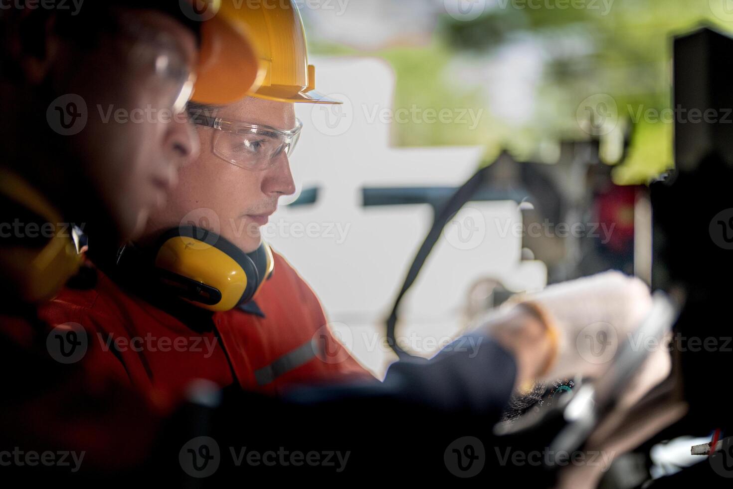 male engineer workers maintenance automatic robotic arm machine in a factory. worker checking and repairing automatic robot hand machine. technician worker check for repair factory machine. photo