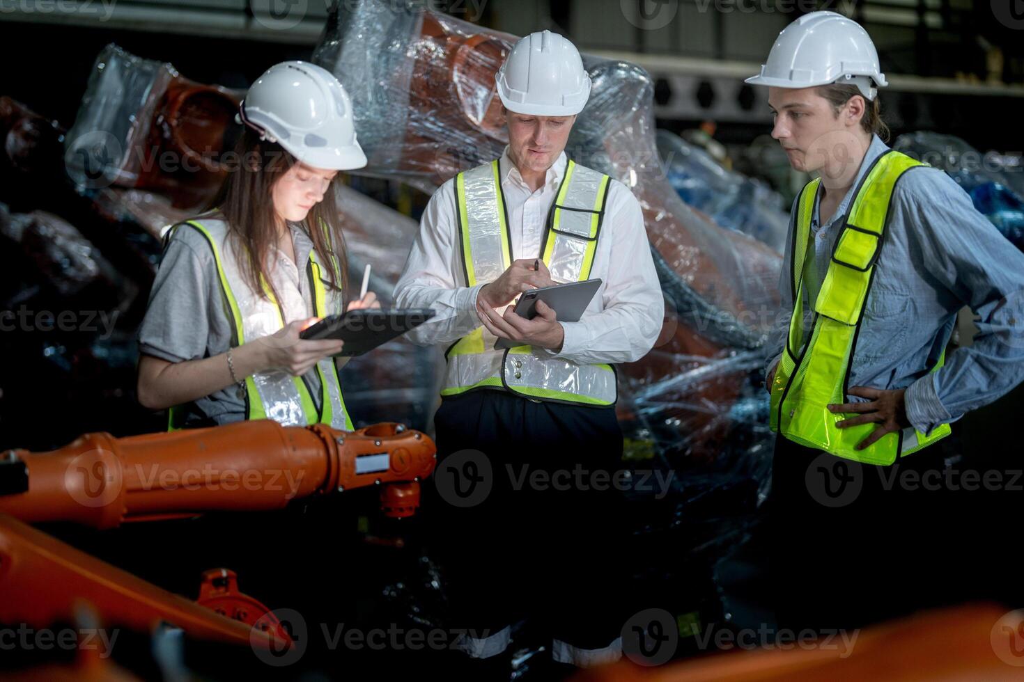 Sales manager and factory owner in suits negotiating selling robots used in the factory. Business engineers meeting and checking new machine robot. Workers walking at warehouse welding machine. photo