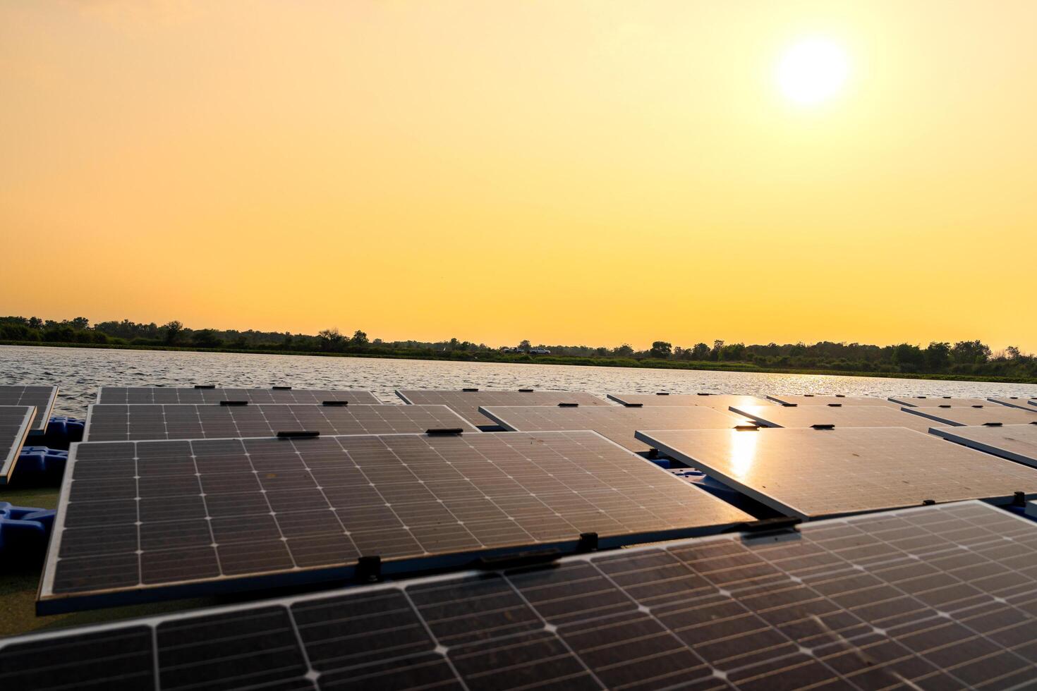 Floating solar panels on water lake. solar panels at sun light. clean energy for future living. Industrial Renewable energy of green power. photo