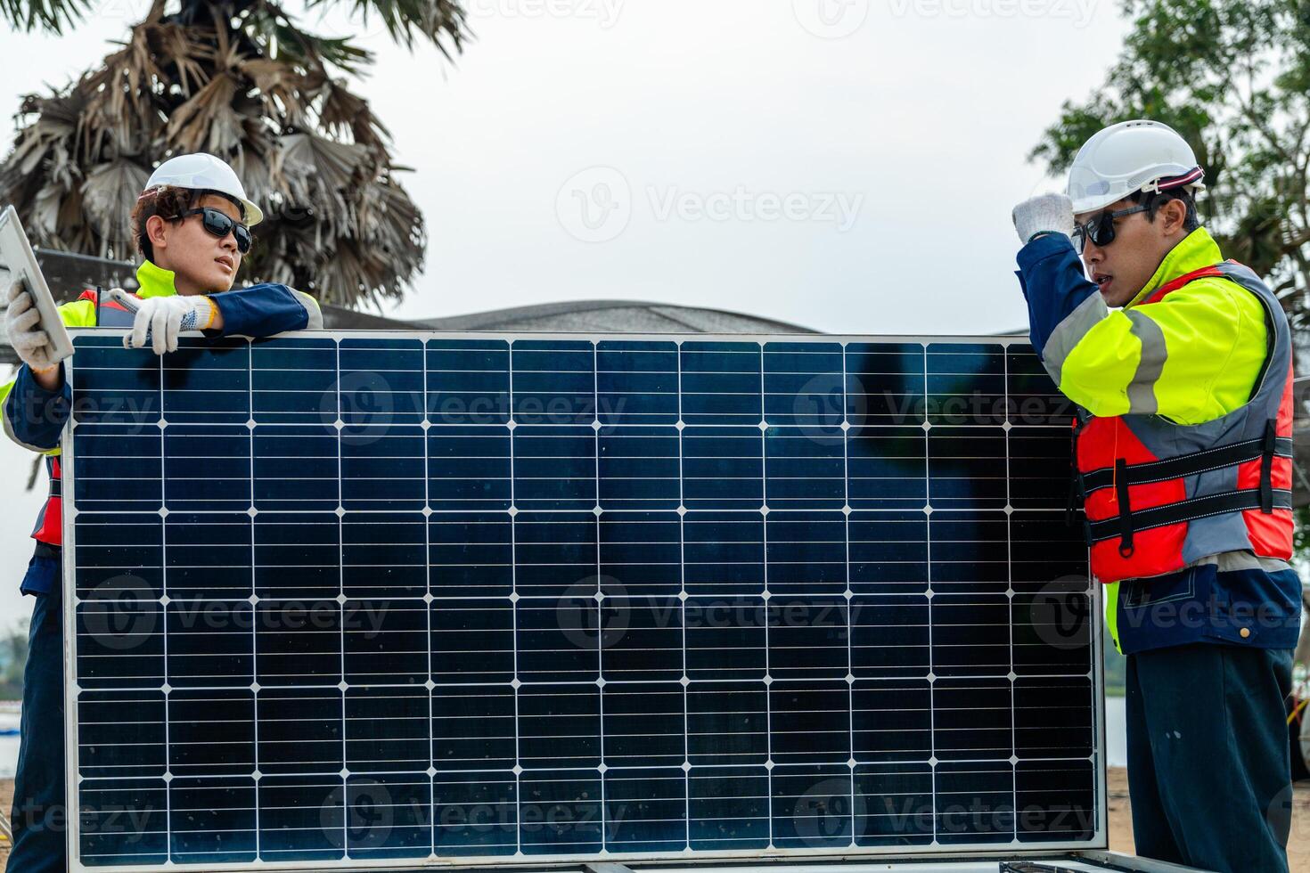 Workers Technicians are working to construct solar panels system on construction site. engineers are checking before Instal solar photovoltaic panel system. Renewable clean energy technology concept. photo
