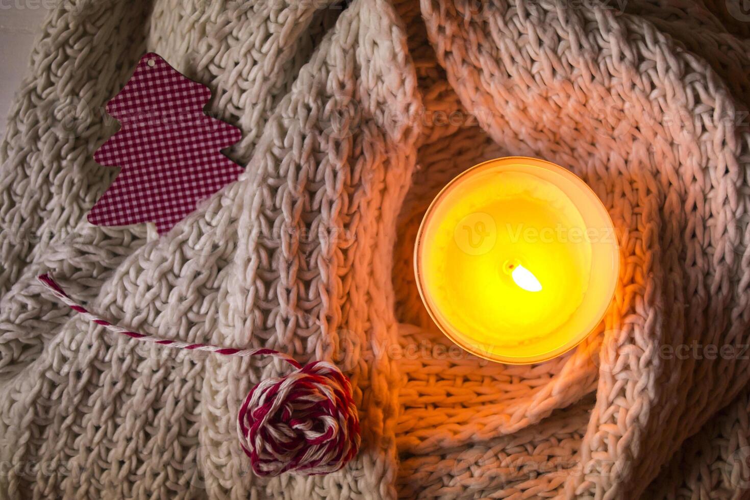 Burning candle and christmas decoration. photo