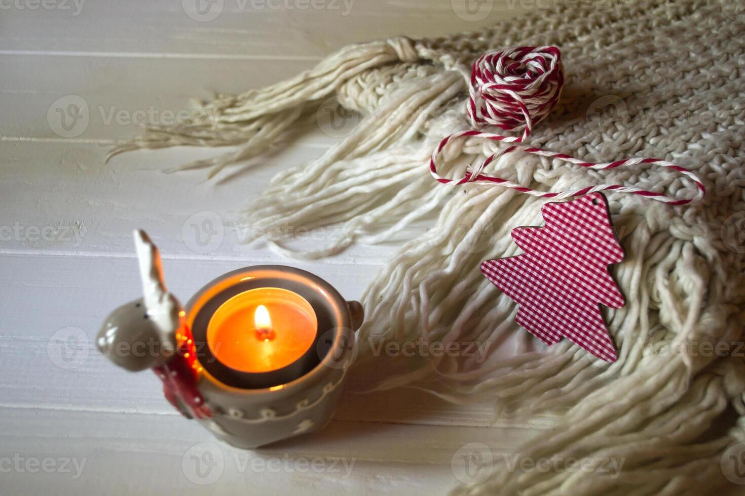 Burning candle and christmas decoration. photo