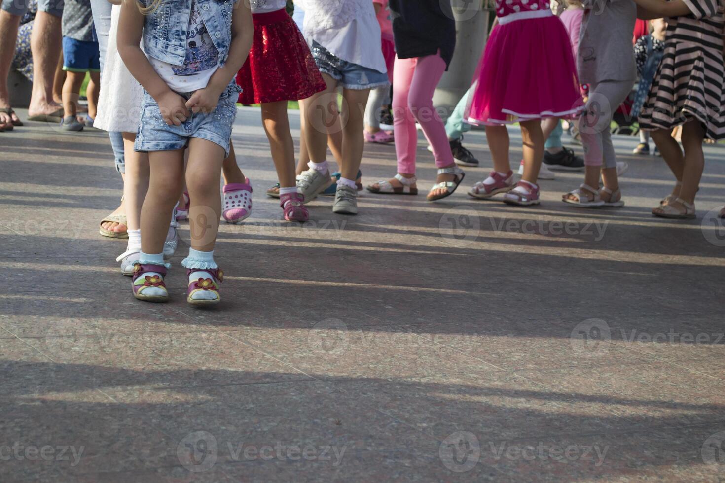 Children's feet one by one. photo