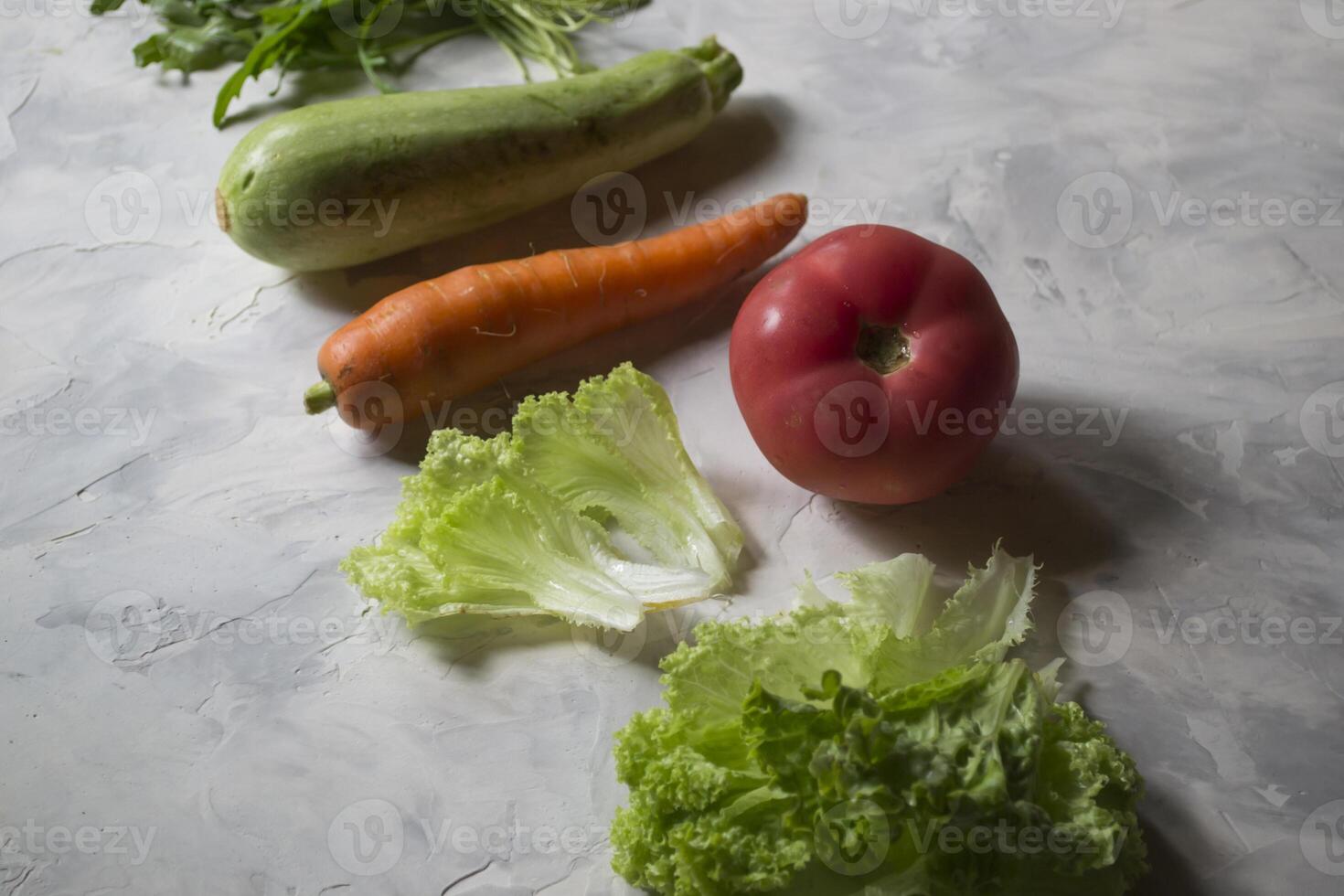 Group of vegetables on a cuisine table. Ingredients for cooking salad. photo