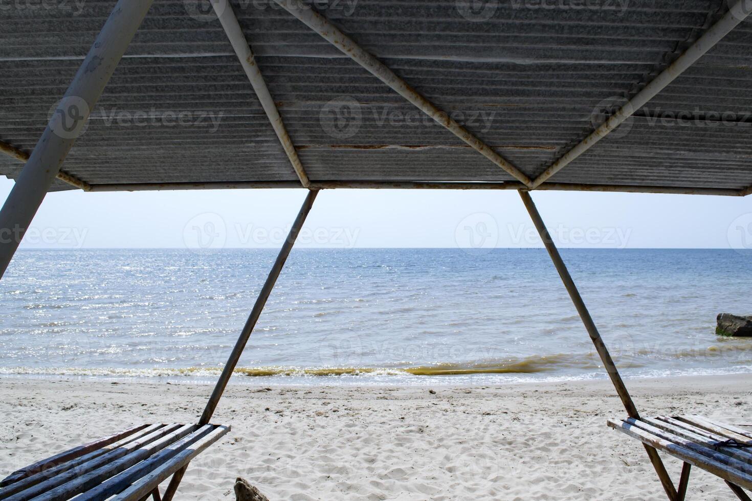 A bower with benches on the beach. Beautiful seascape. The place for rest. photo