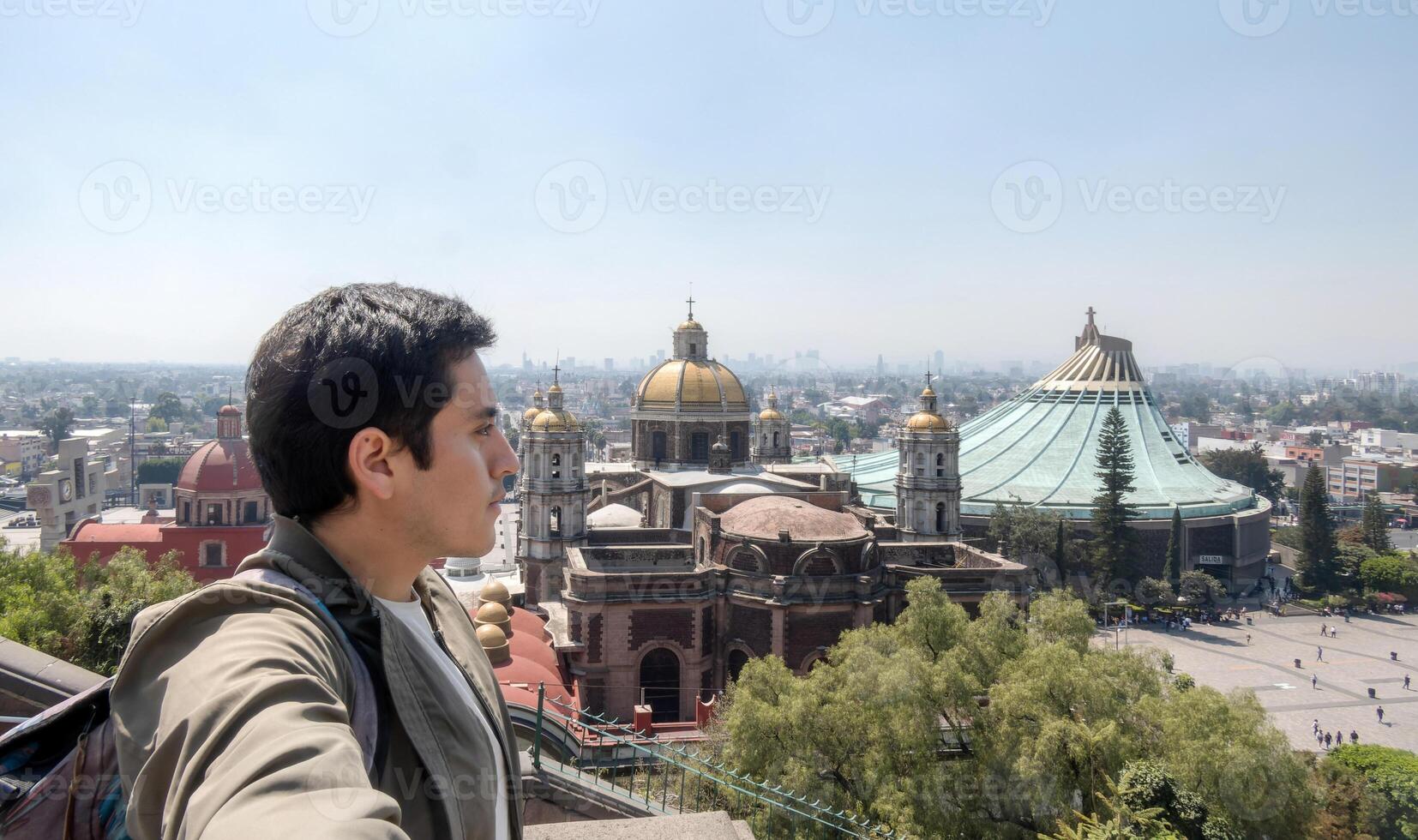 A man in Catholic Church, Basilica of Santa Maria de Guadalupe, pilgrimage site, Mexico photo