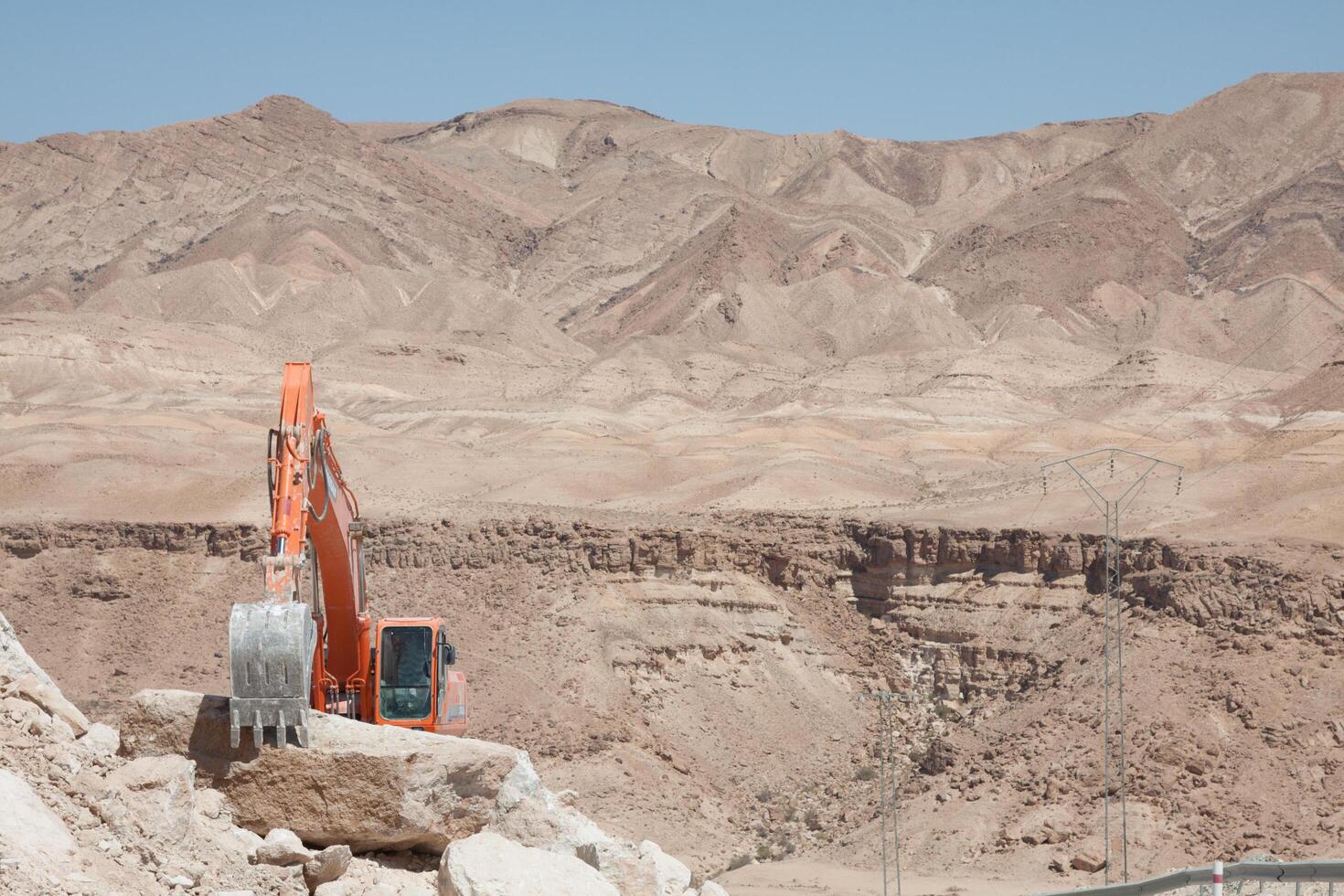 Excavator building a mountain road in the atlas mountain photo