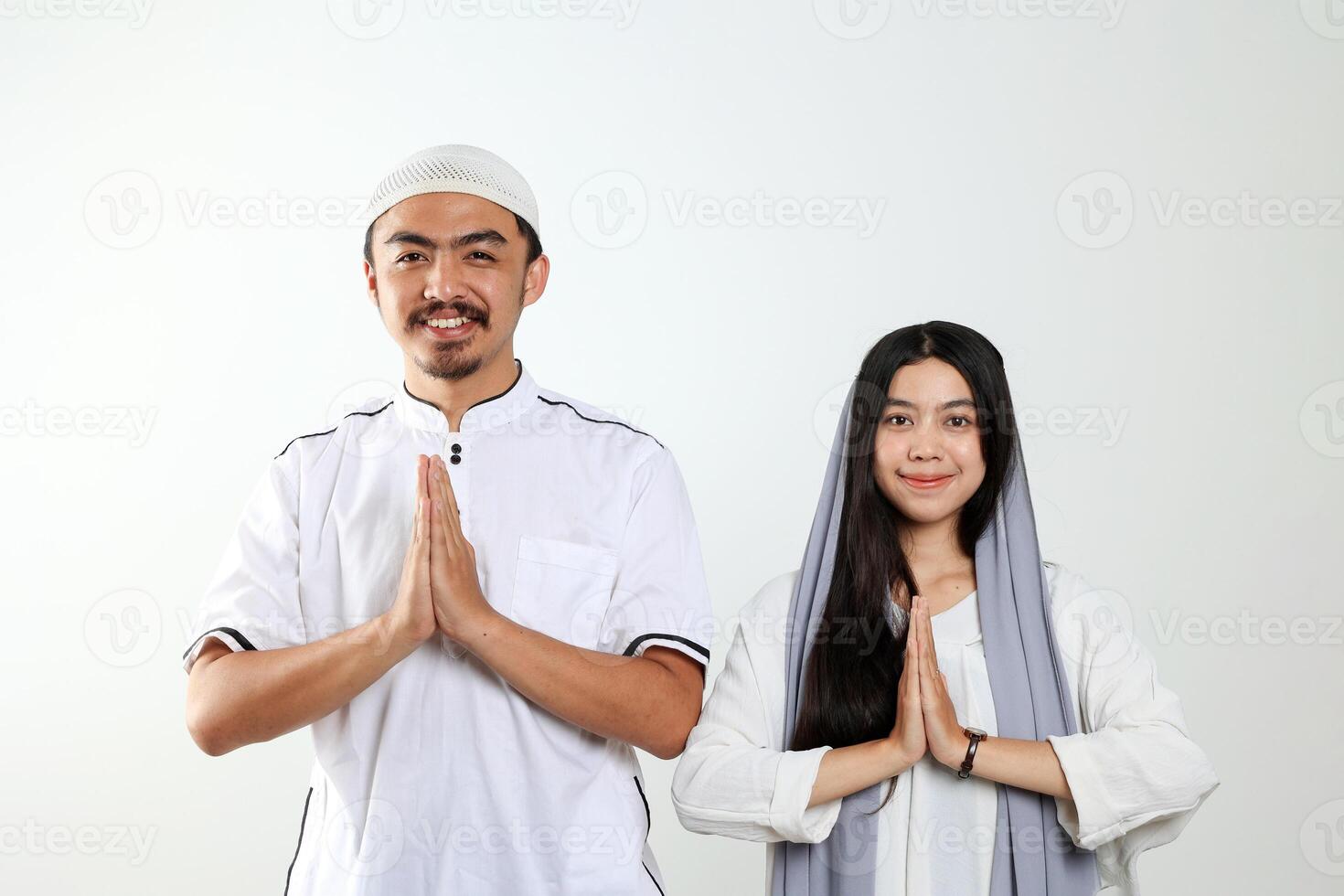 Muslim Couple Doing Muslim Greeting Gesture photo