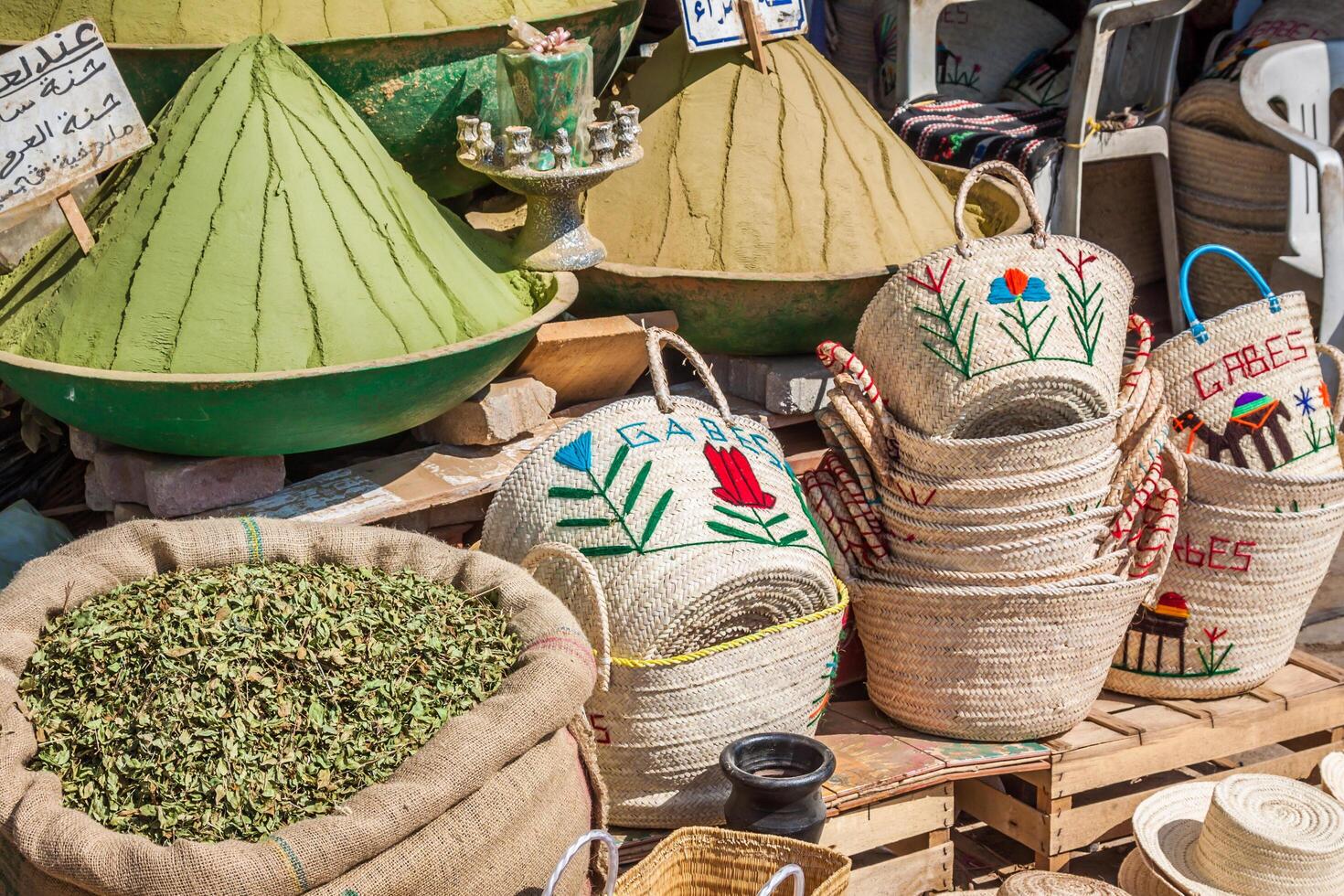 Beautiful vivid oriental market with baskets full of various spices photo