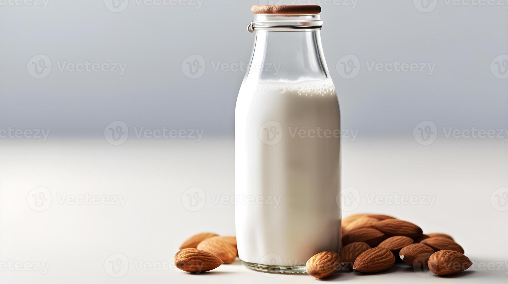 AI generated almond milk in a glass bottle with nuts on a white background photo