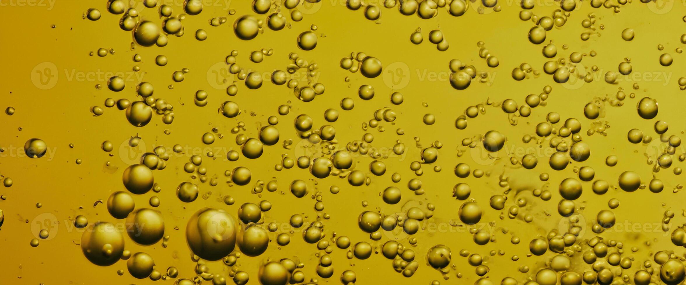 Golden Hyaluron Oil bubbles collagen serum or yellow oil bubbles drop texture background photo