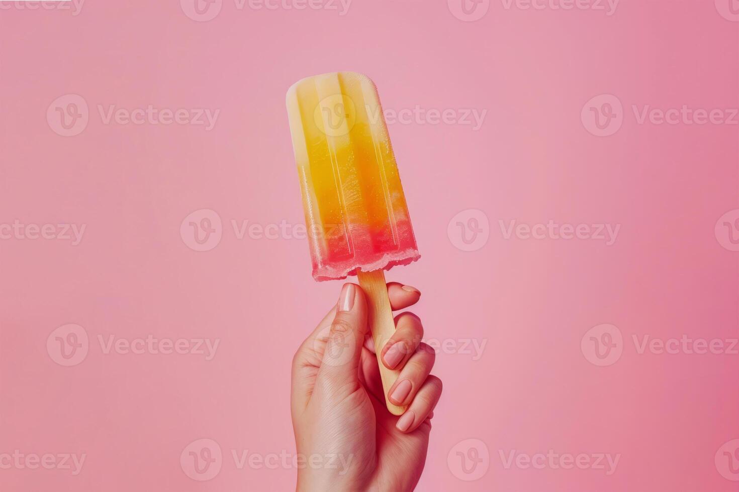 AI generated Female Hand Holds Vibrant Fruit Ice Pop Against Pink Backdrop photo