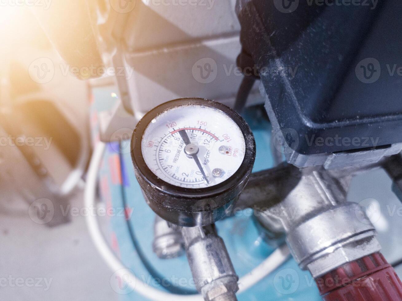 Pressure gauge  and safety valve for measurement air compressor. photo