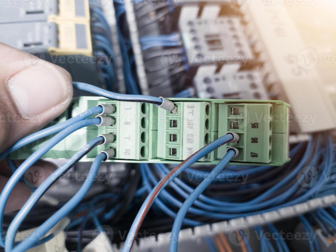 Check and repair electrical component the automatic turning relay on the panel board control machinery. photo
