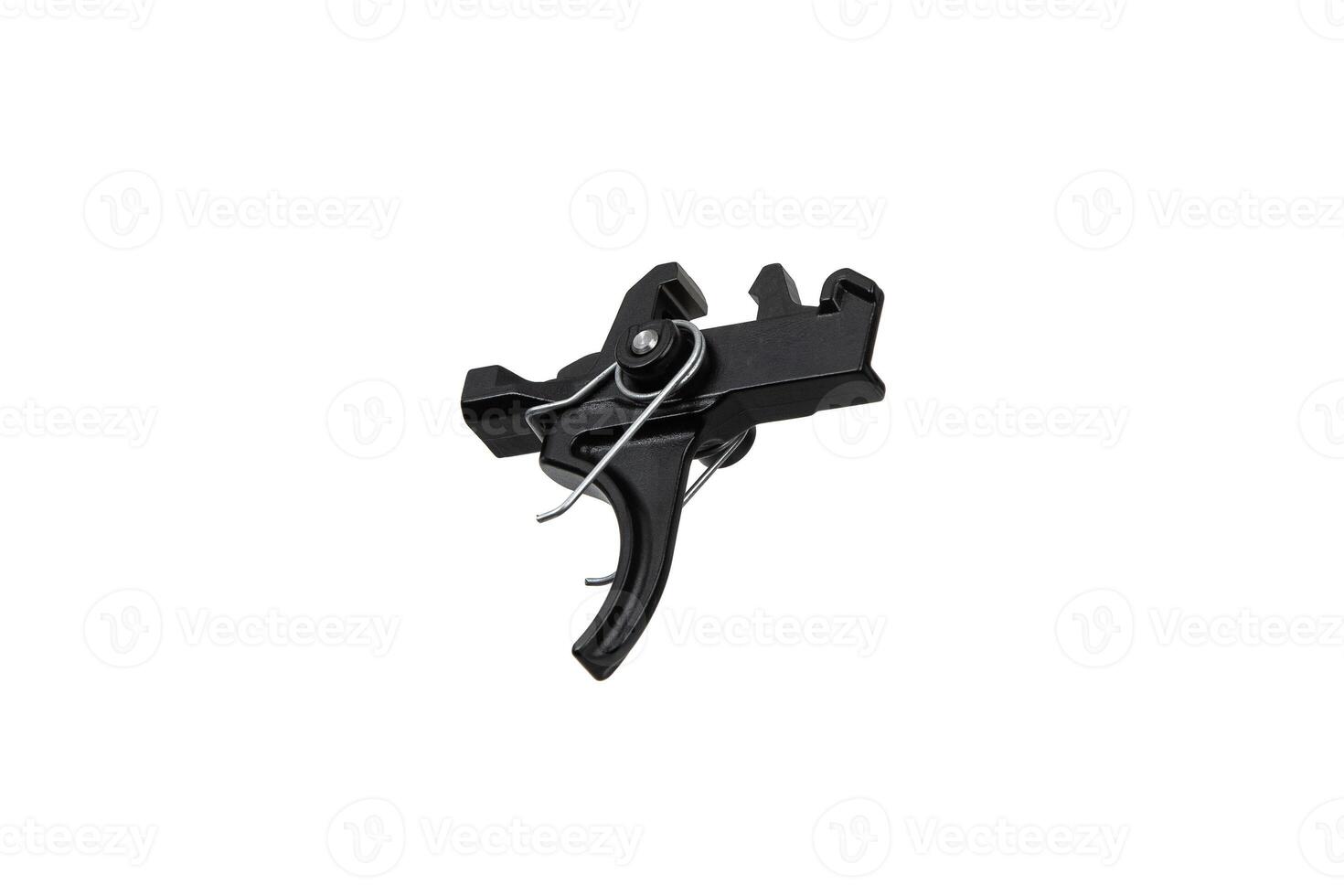 Shock trigger for gun isolate on white back. Gun trigger. Repair spare part. photo